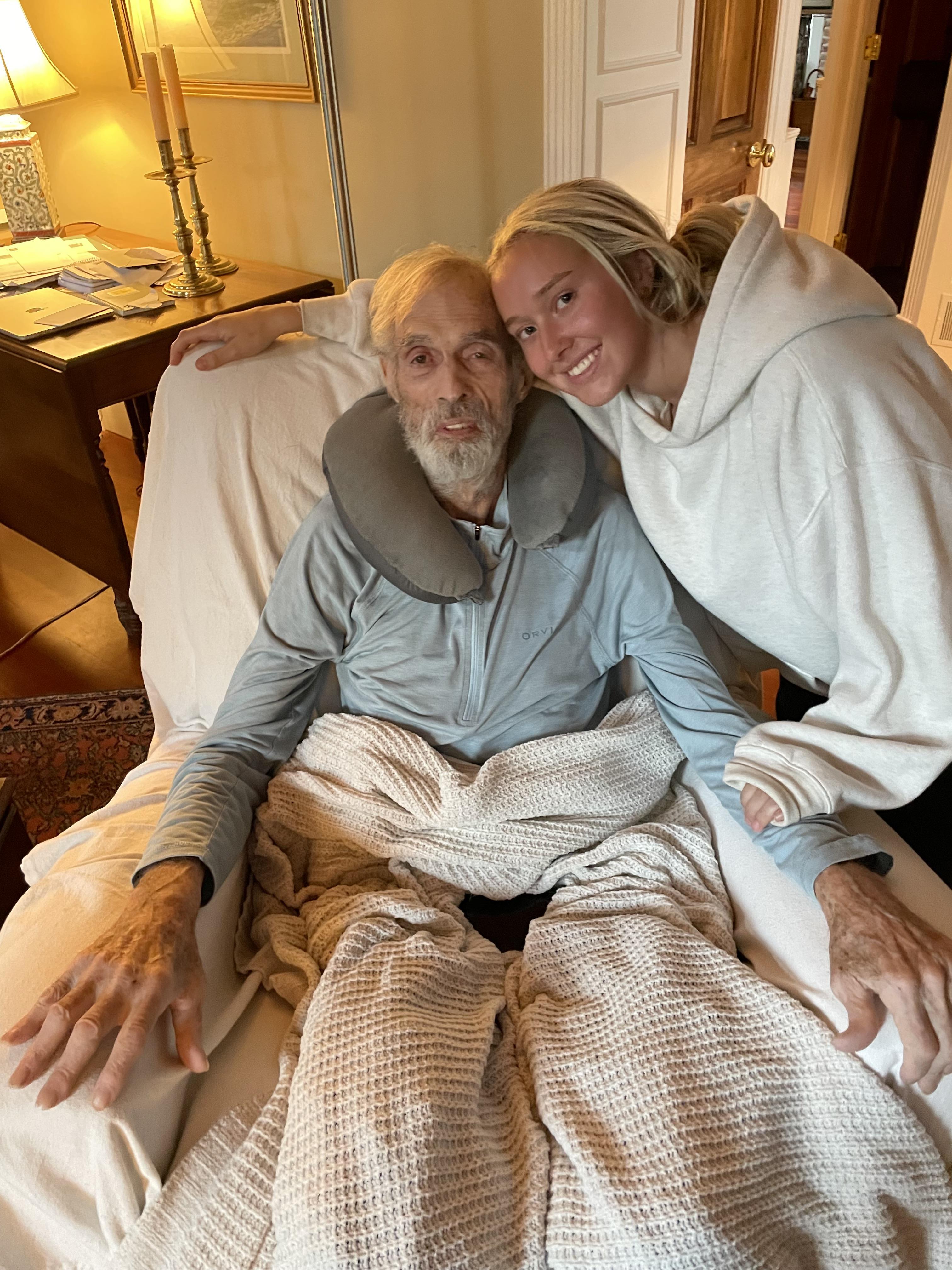 A man in a hospital bed with a woman