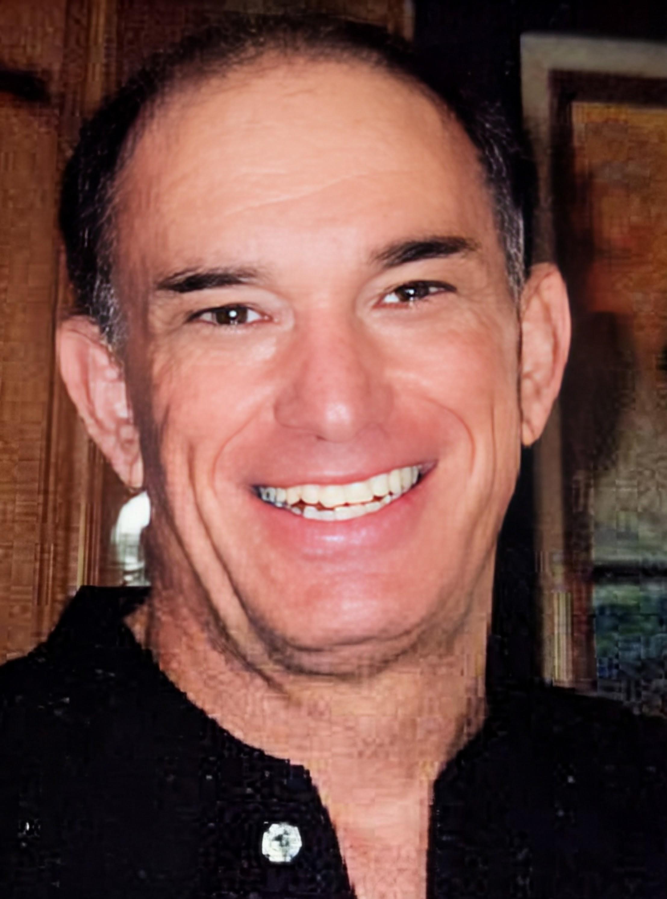 A man smiling at the camera