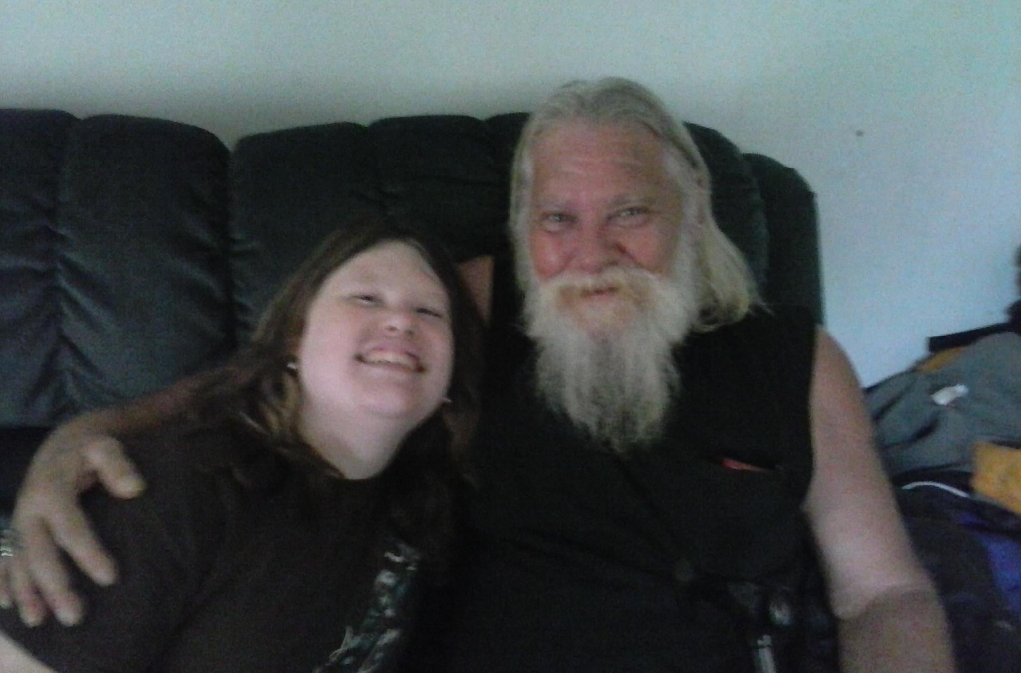 A man and woman sitting on a couch
