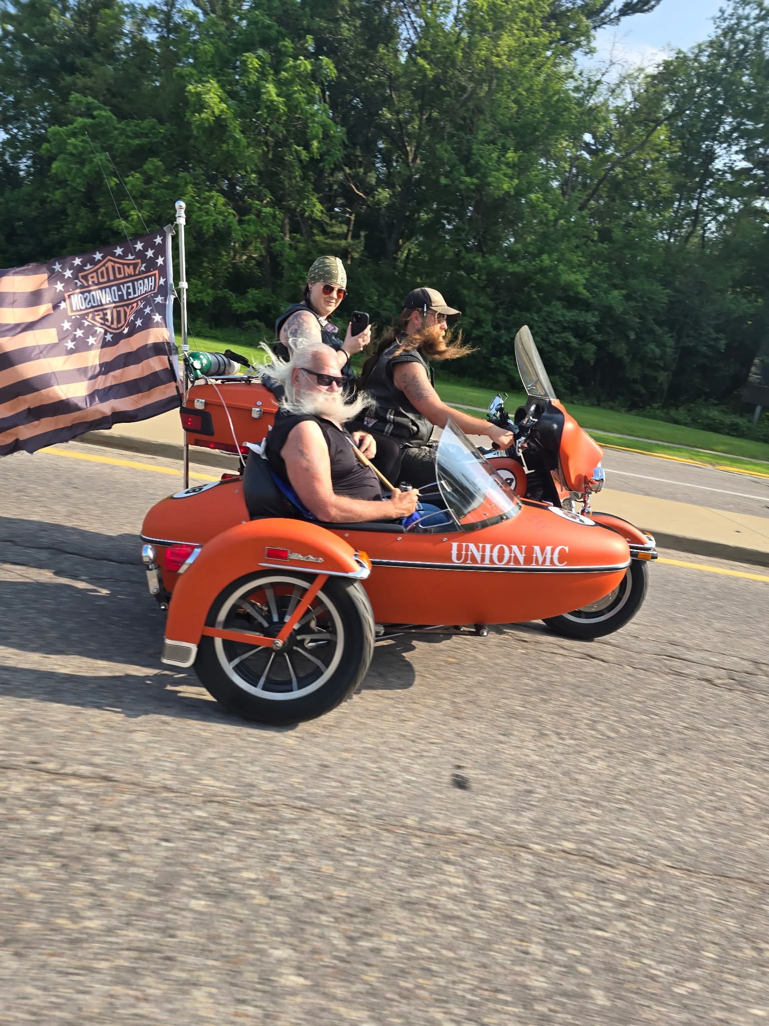 A group of people riding a motorcycle