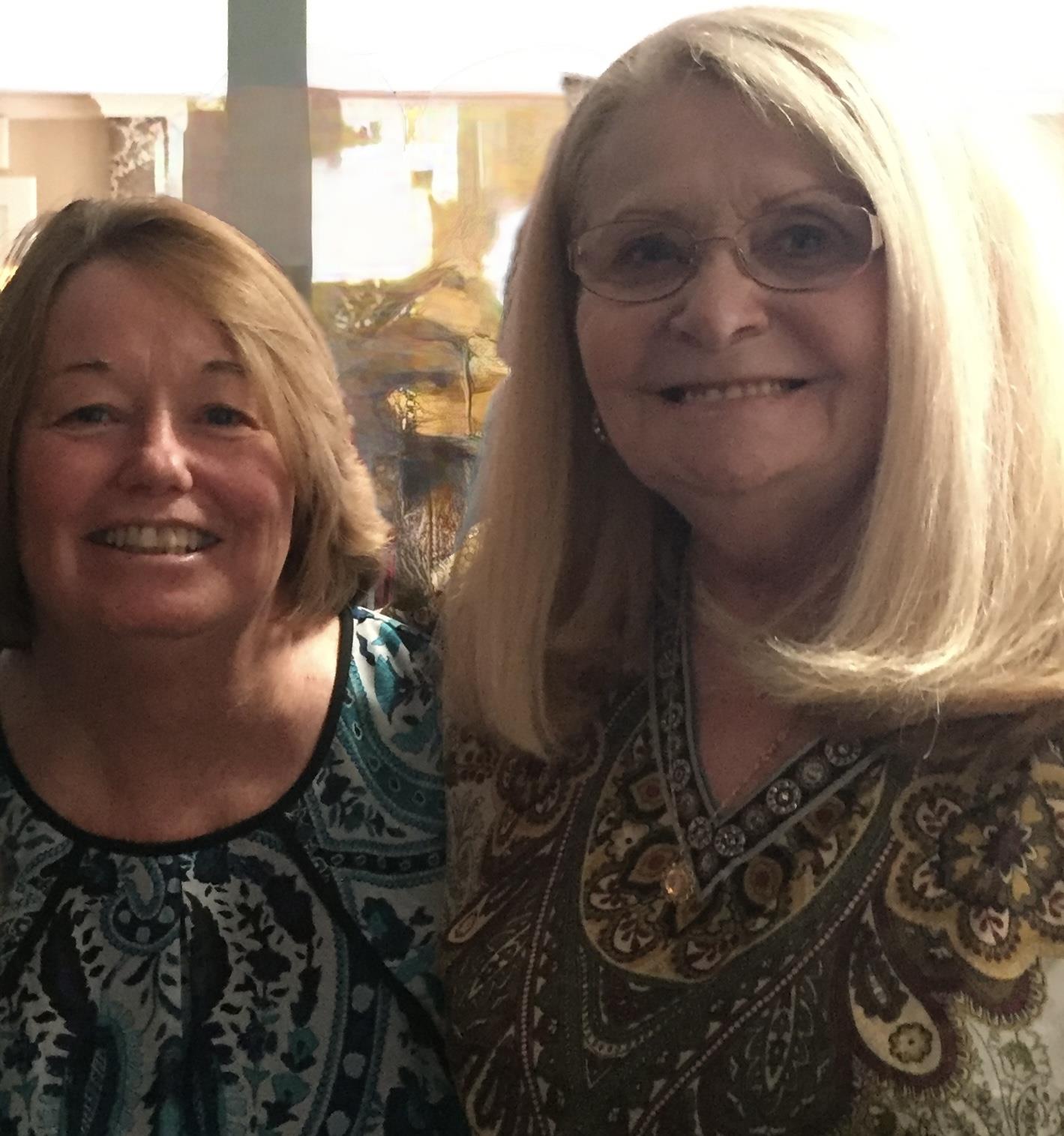 Two women smiling at the camera