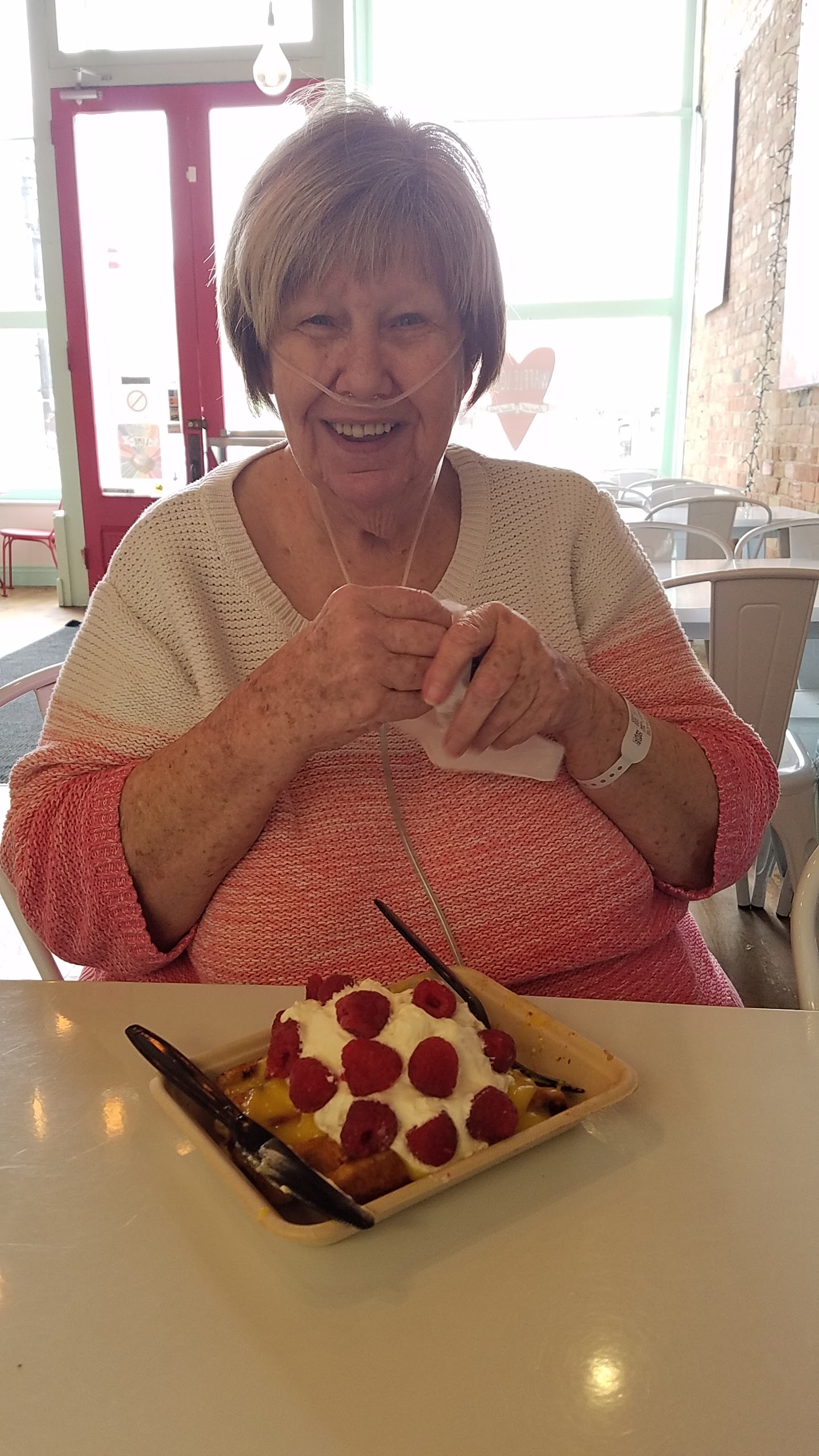 A woman sitting at a table with food
