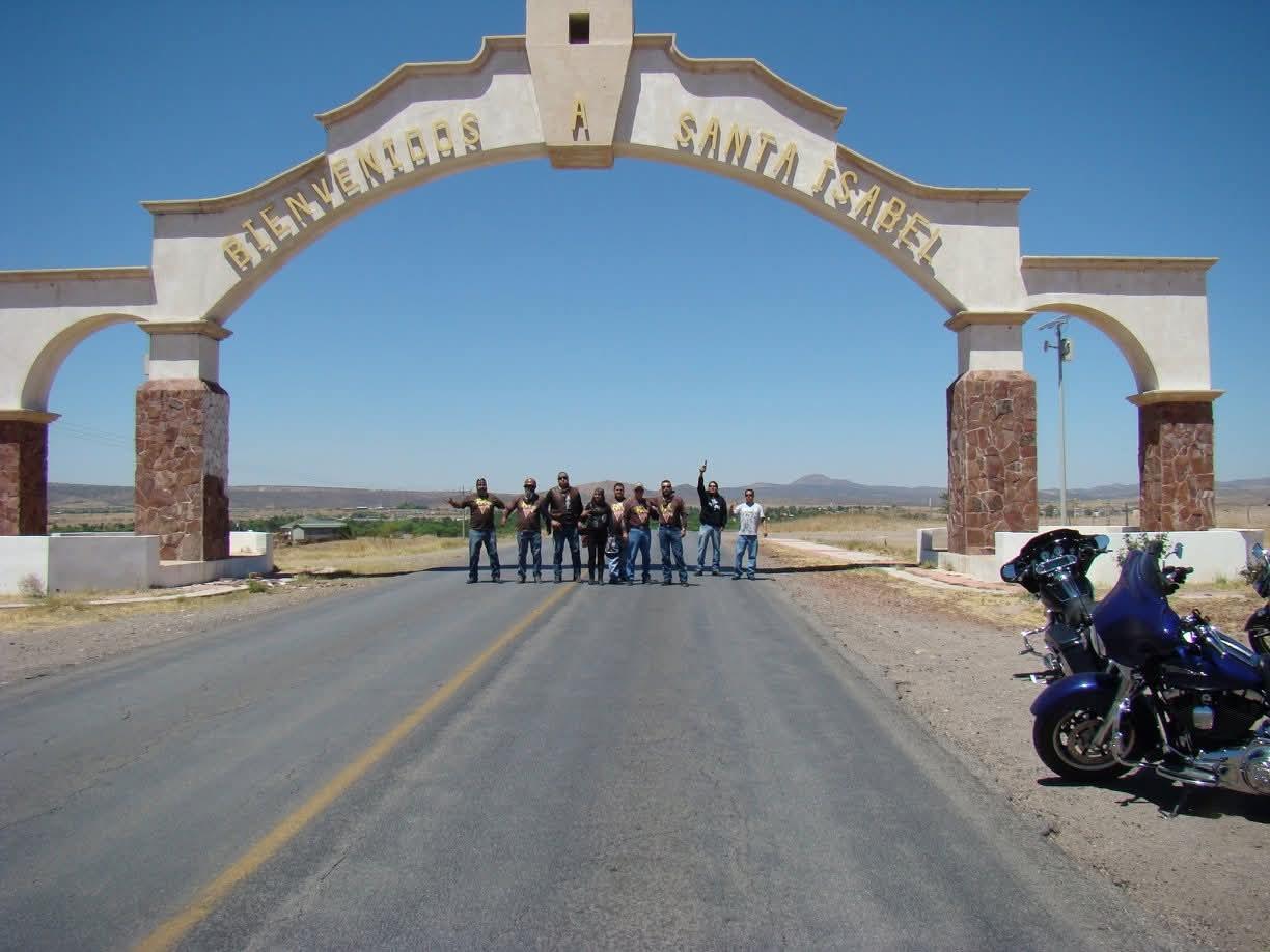 A group of people standing under a archway