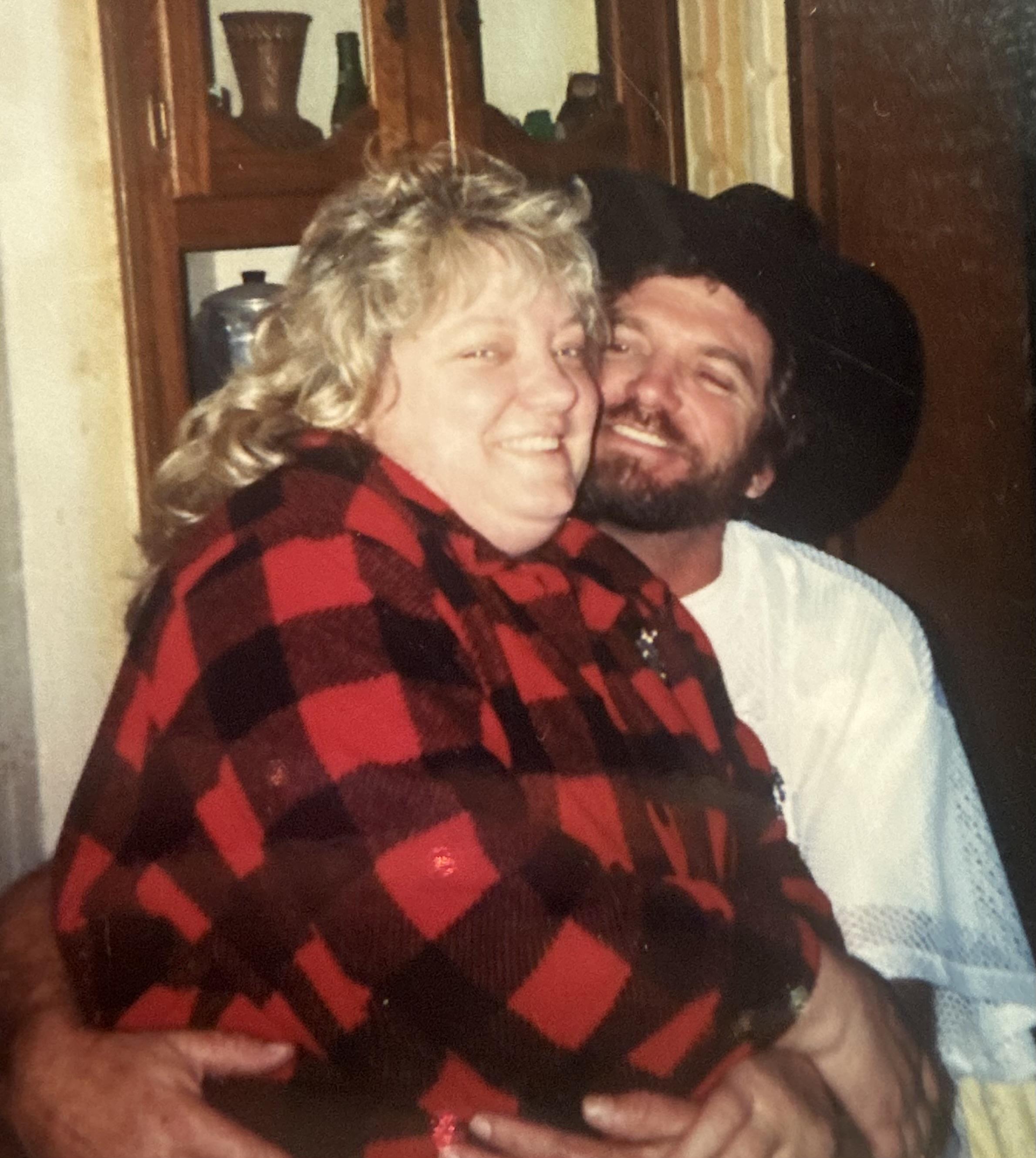 A man and woman smiling