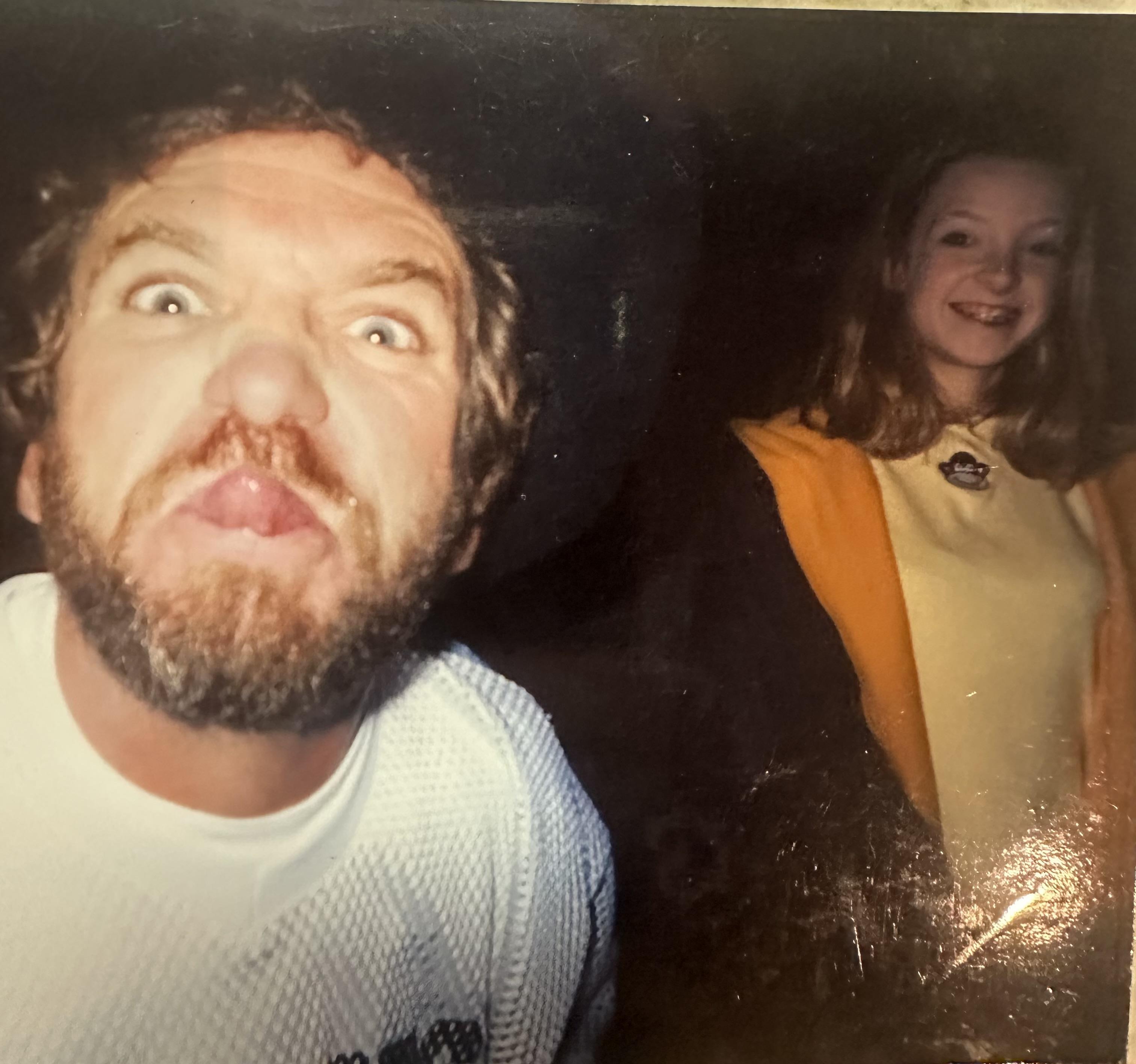 A man making a funny face with a woman