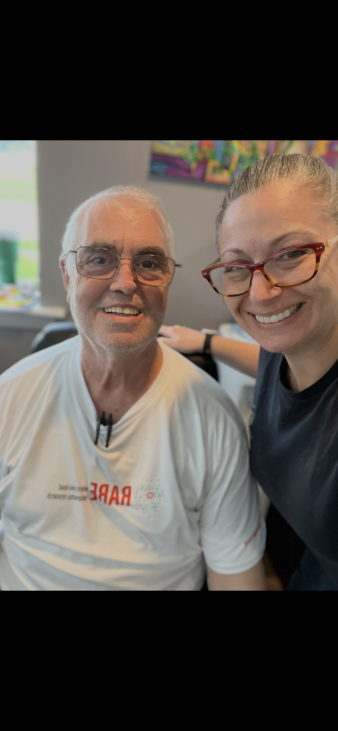 A man and woman smiling for a selfie