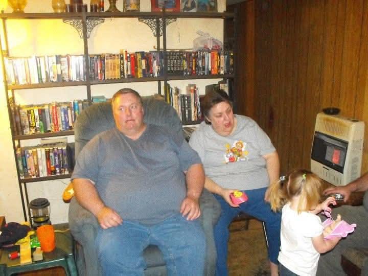 A group of people sitting in a chair