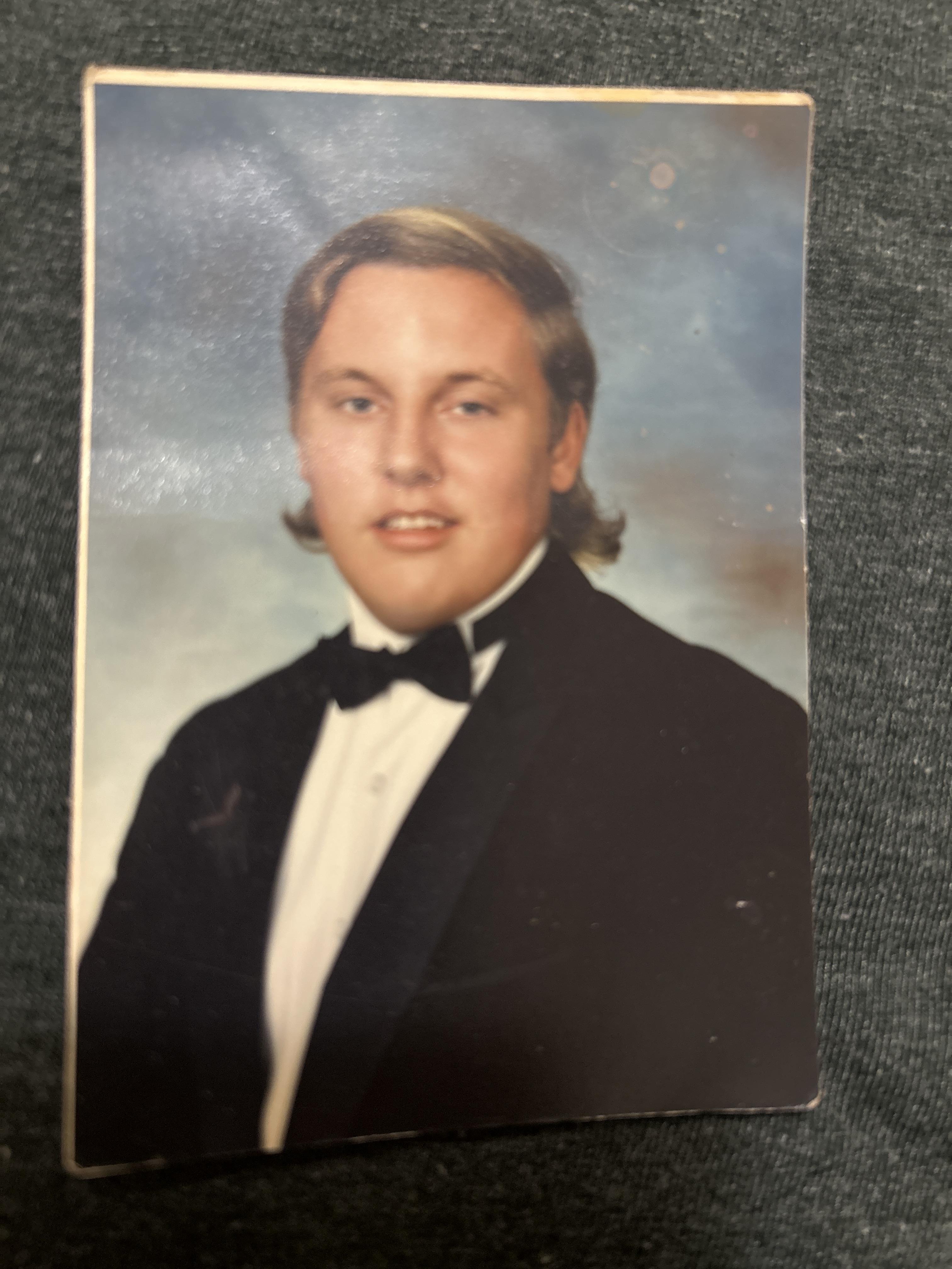 A man in a suit and bow tie