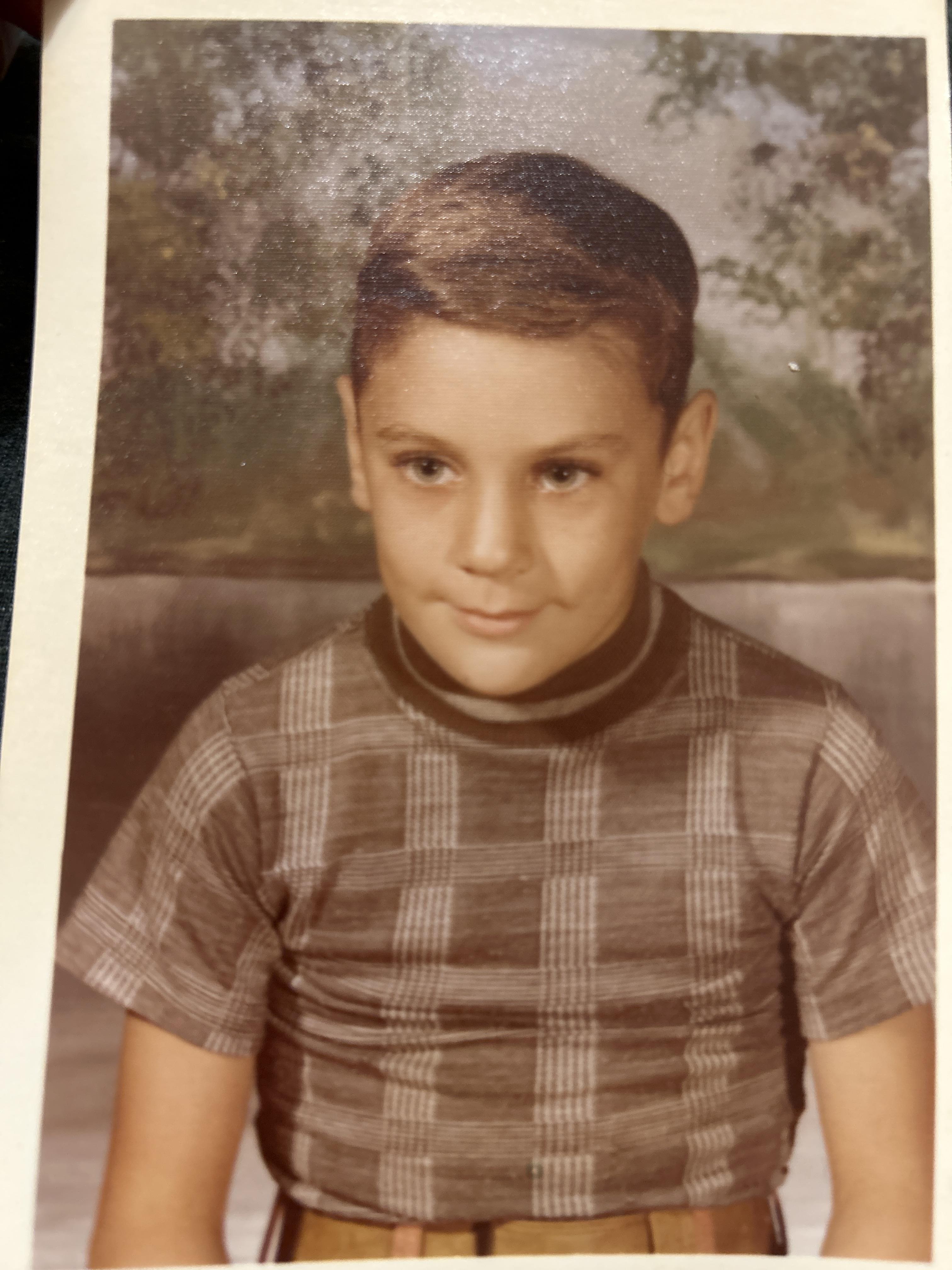 A boy in a plaid shirt