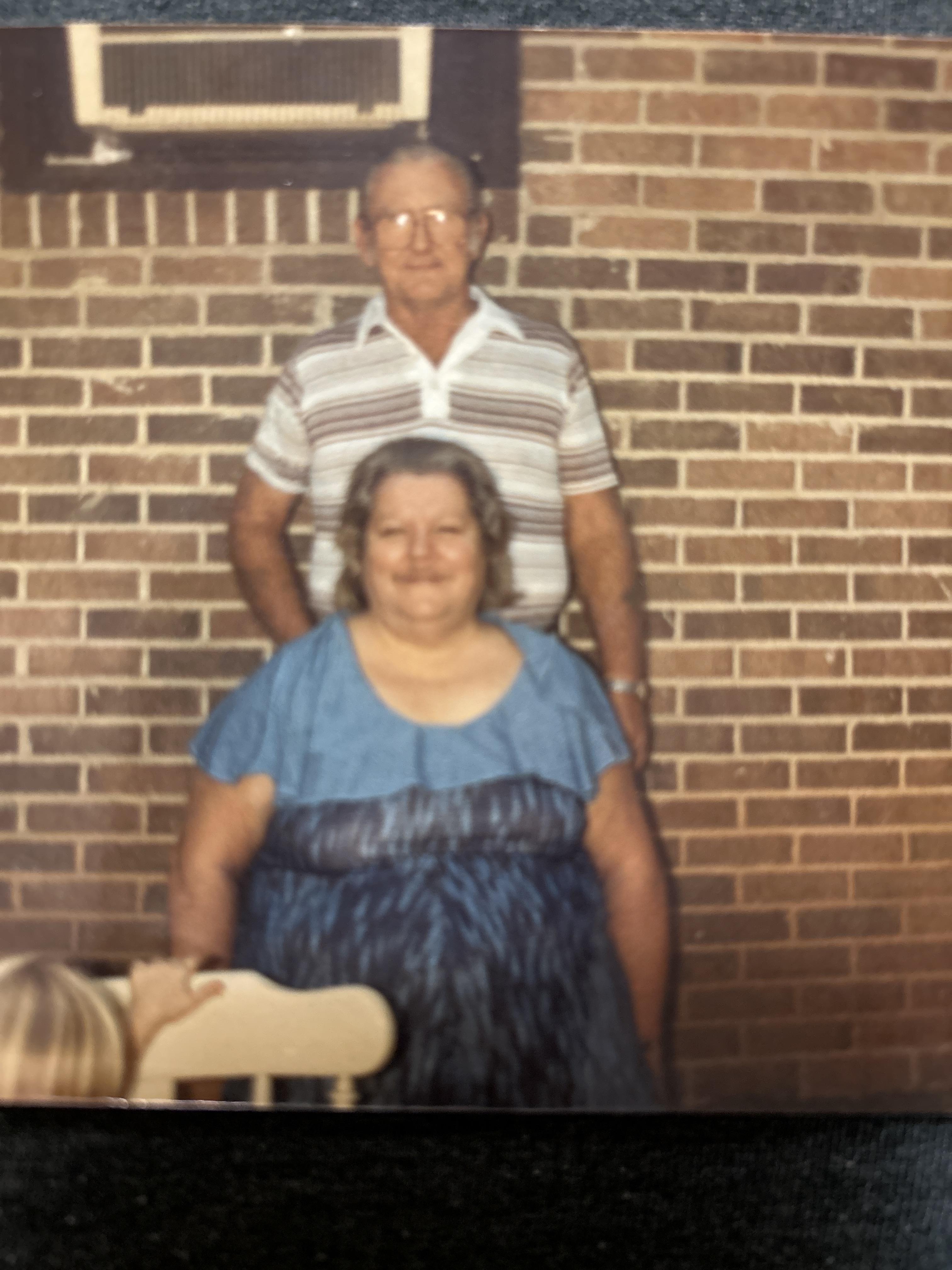 A man standing on a woman's back
