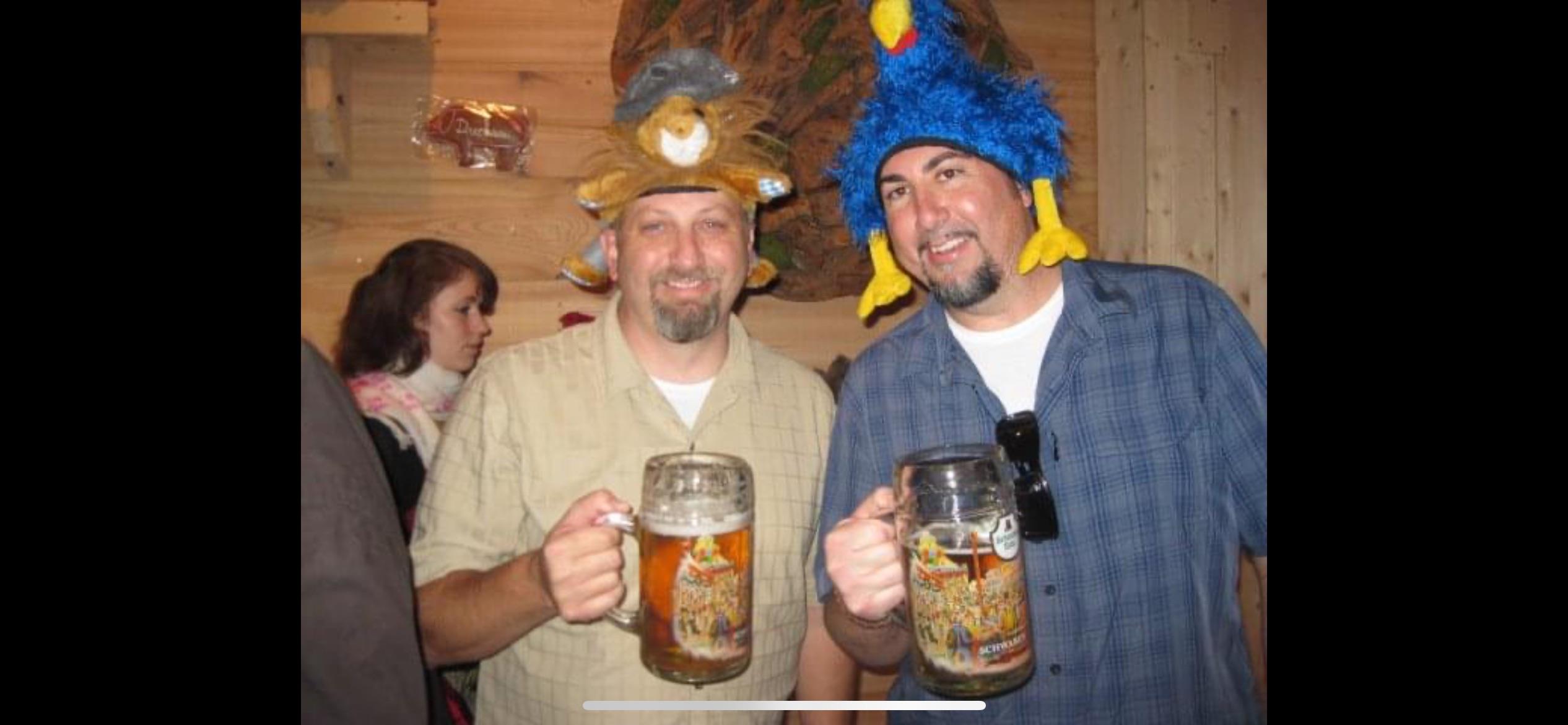 A couple of men holding mugs of beer