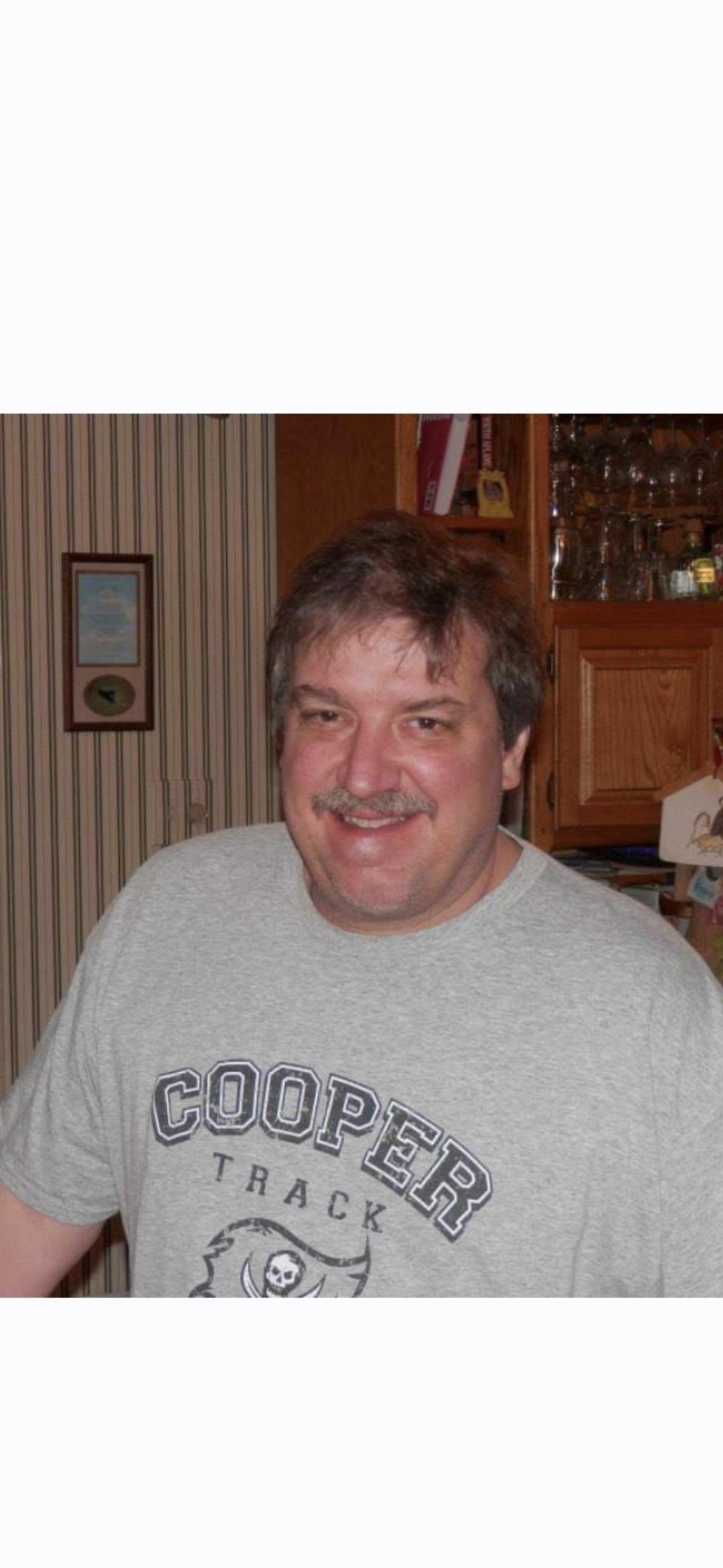 A man smiling at the camera