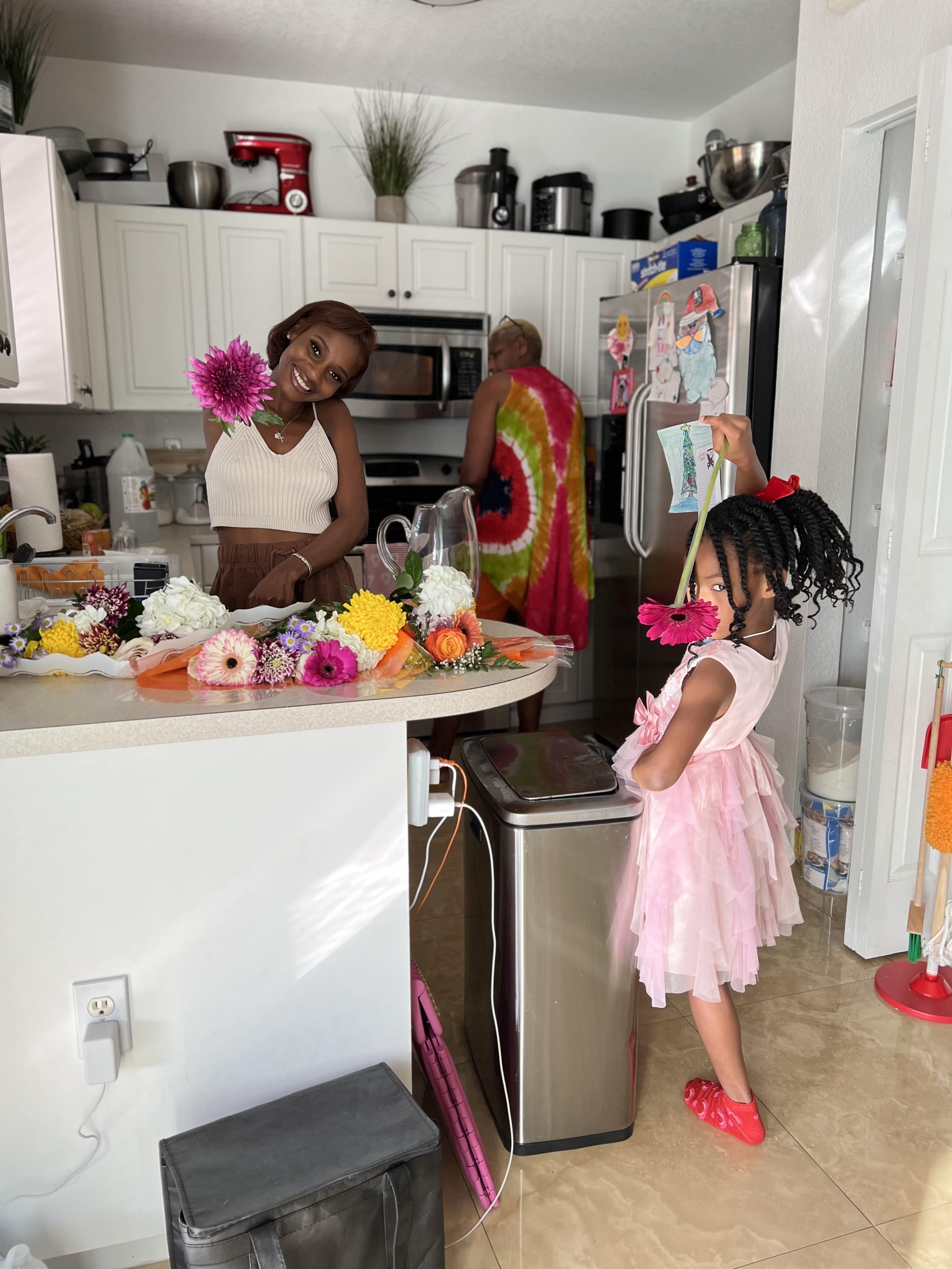 A woman and a child in a kitchen