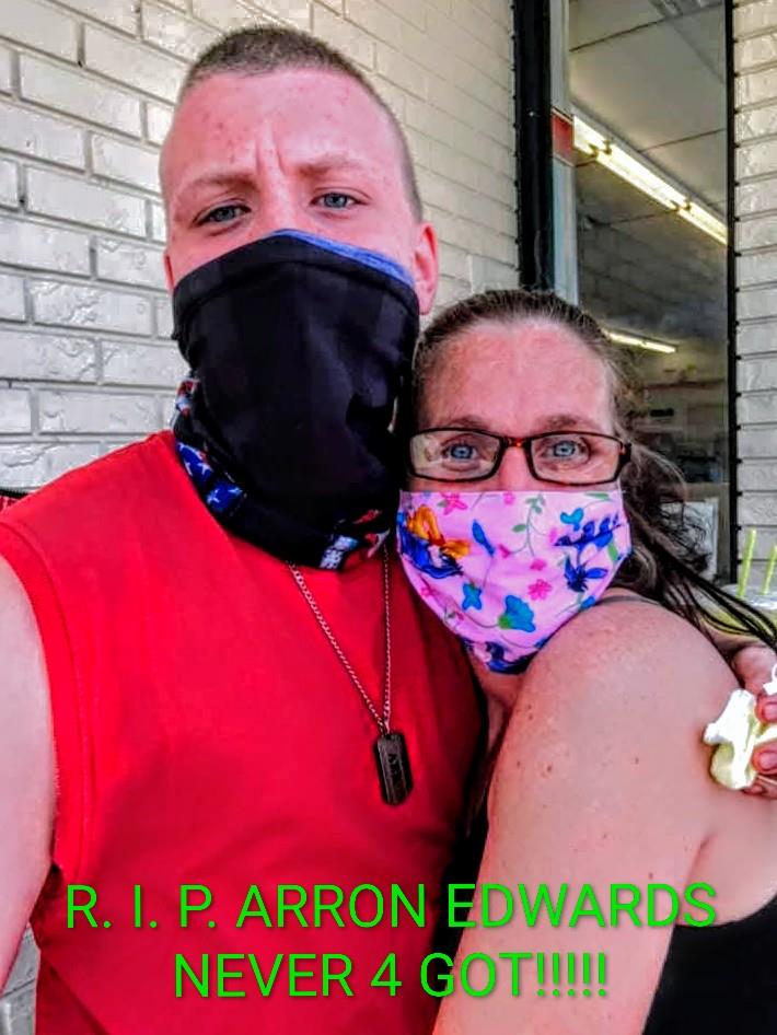 A man and woman wearing face masks