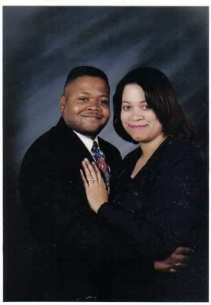 A man and woman posing for a picture