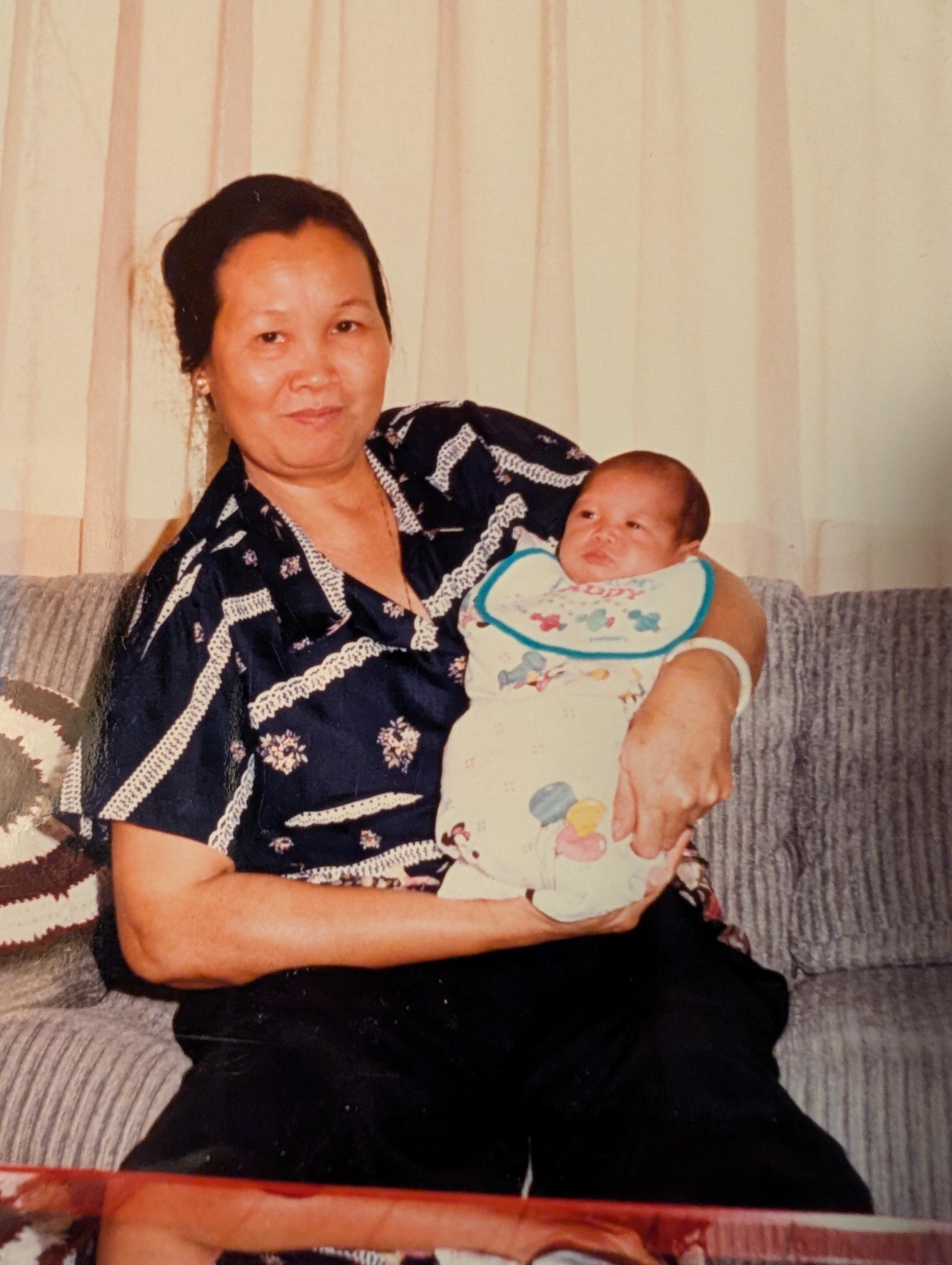 A woman holding a baby