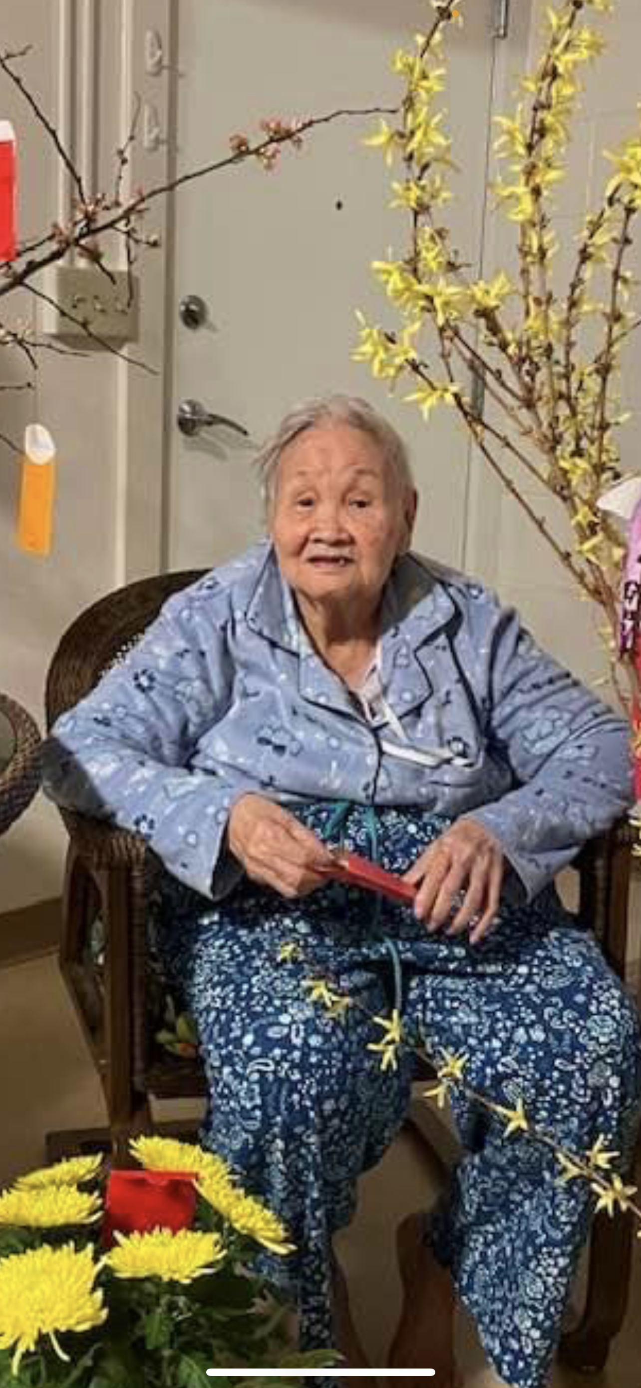 An old woman sitting in a chair
