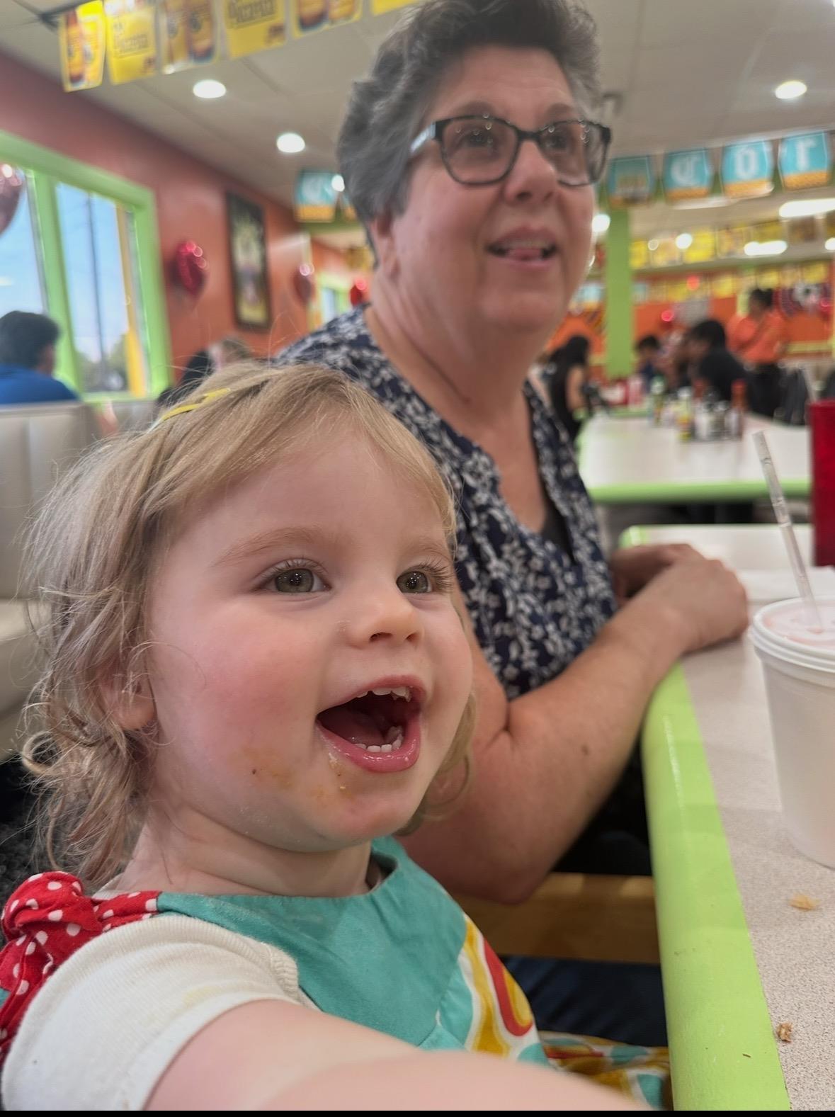 A woman and a child sitting at a table