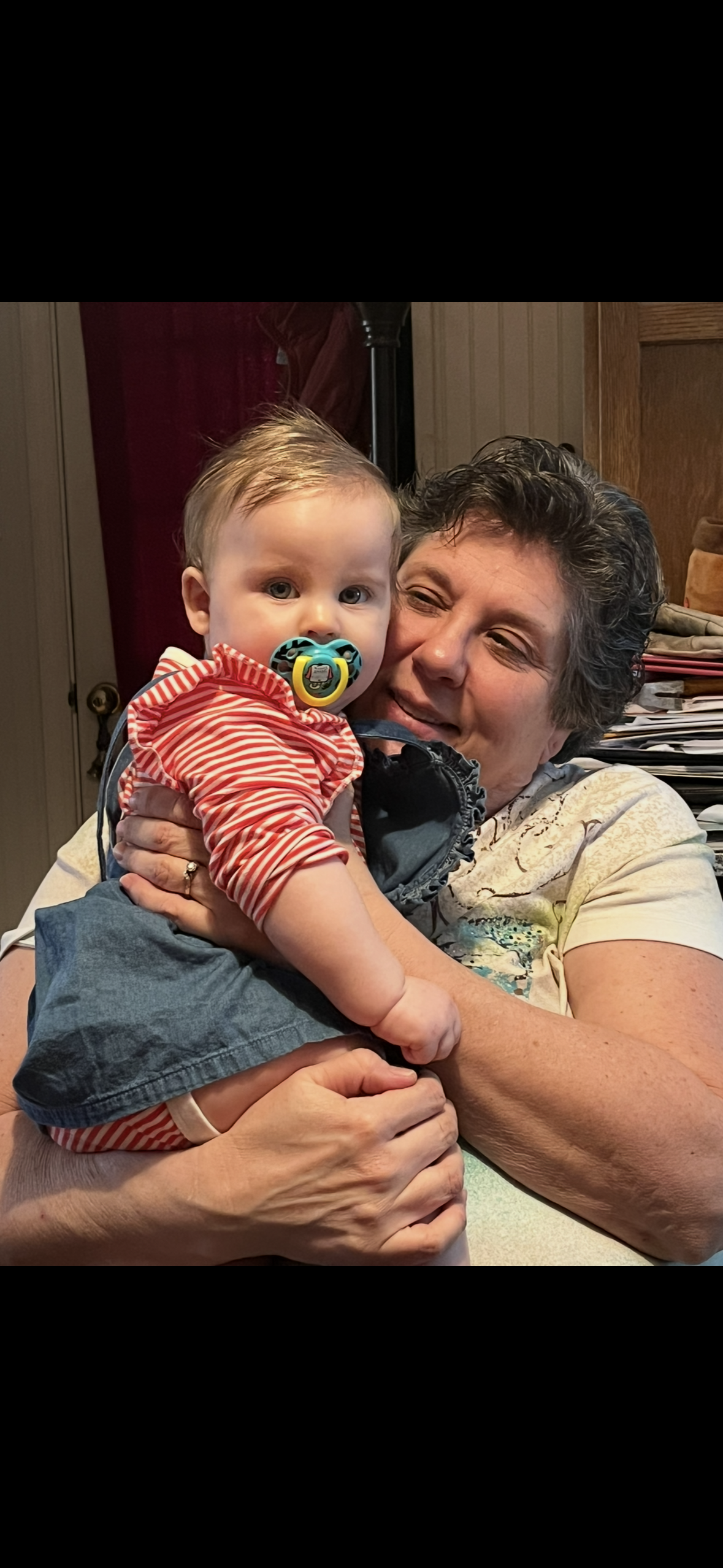 A woman holding a baby