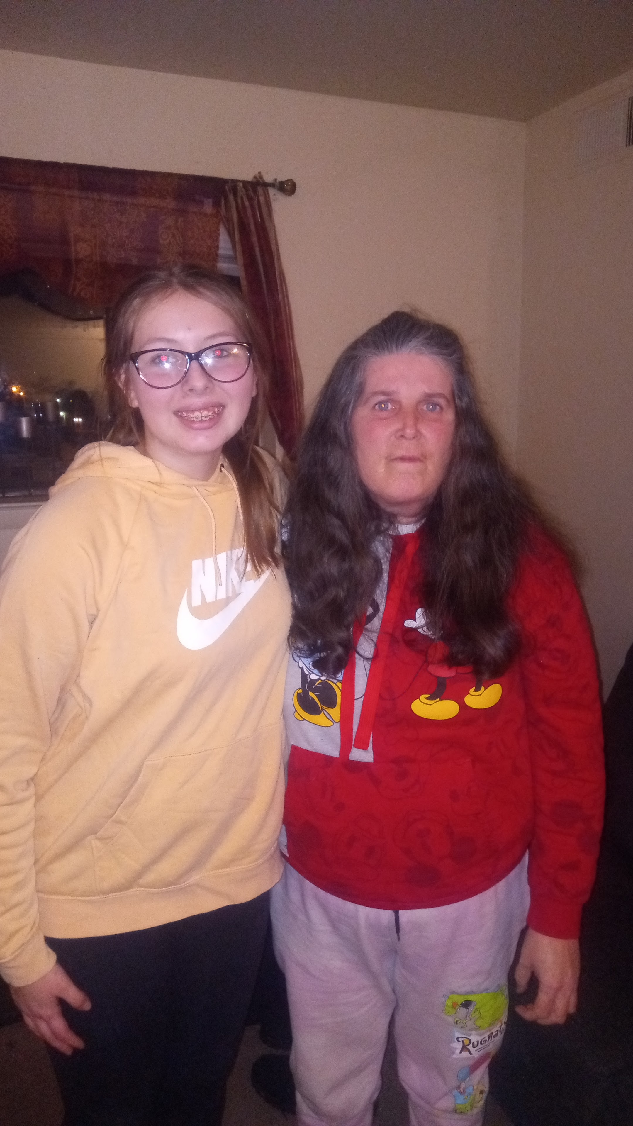 Two women standing next to each other