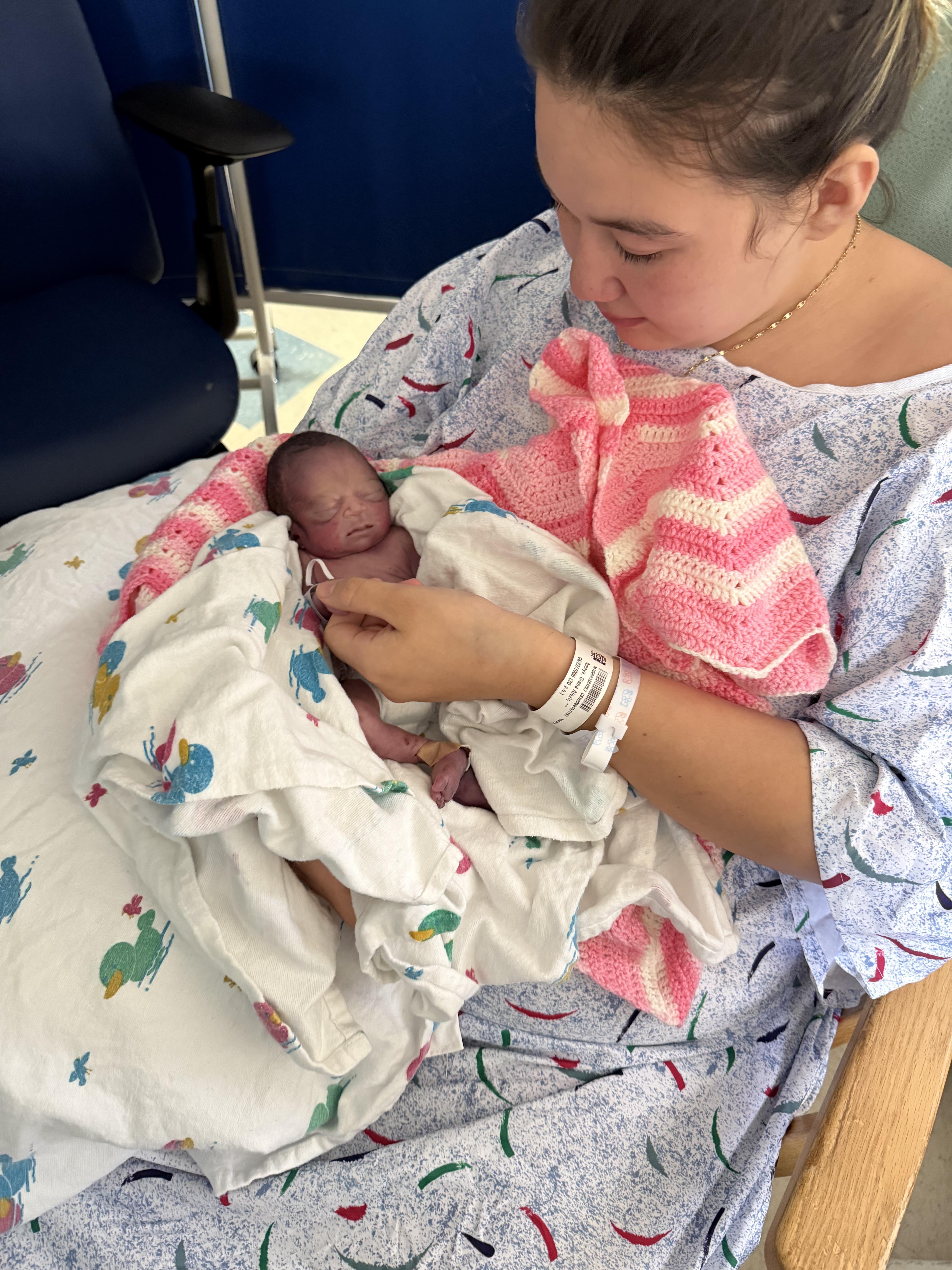 A woman holding a baby