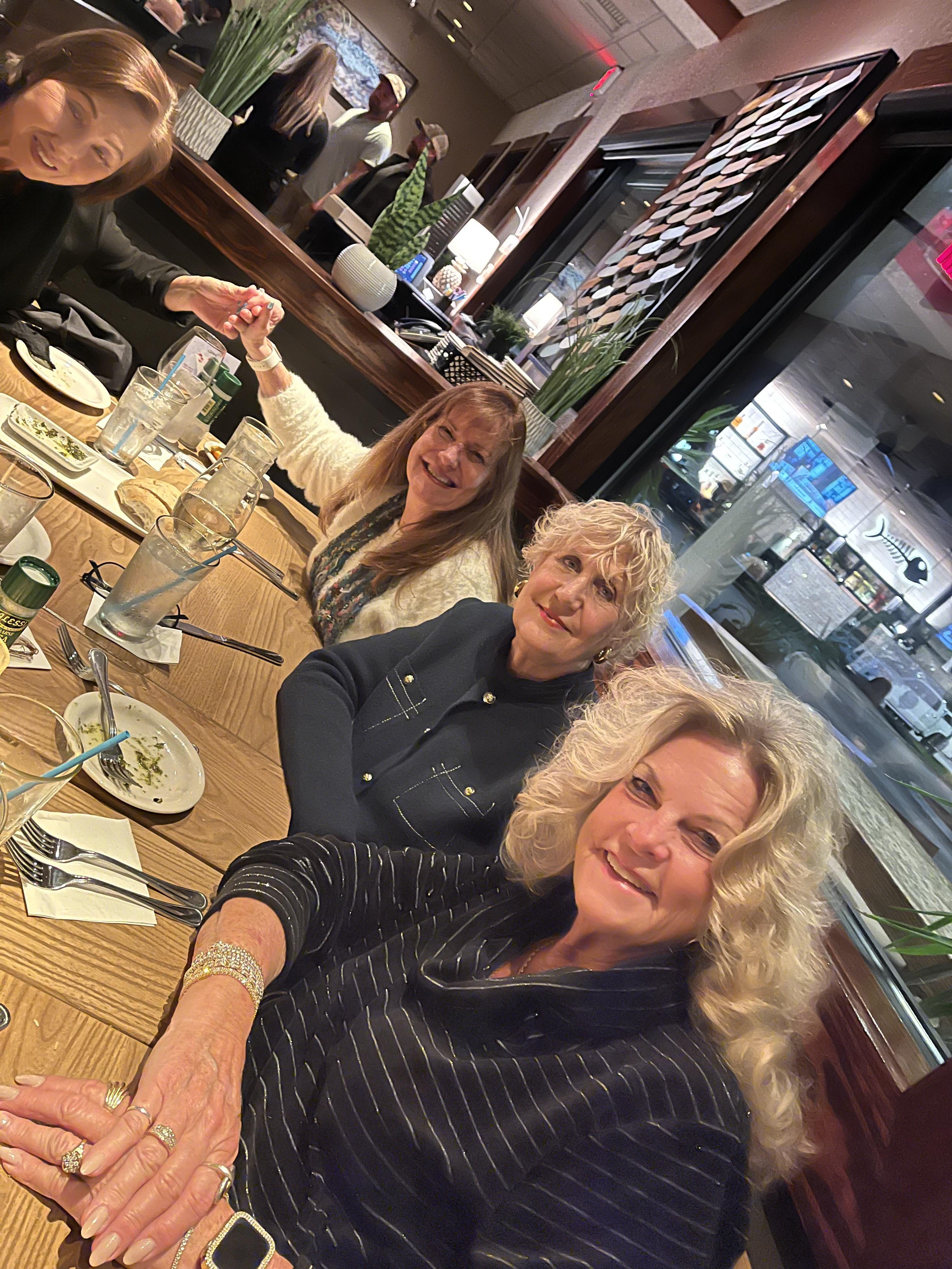 A group of women sitting at a table