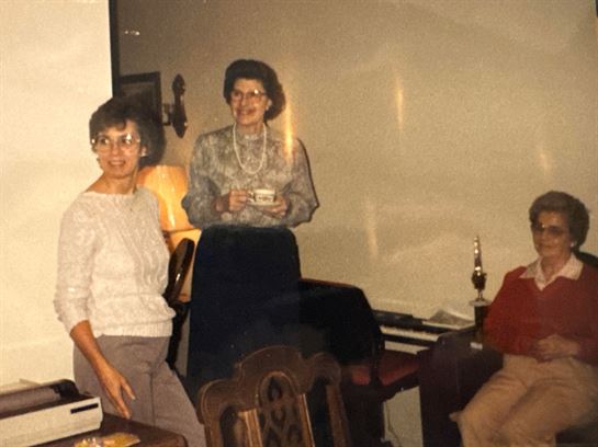 A group of women standing in a room