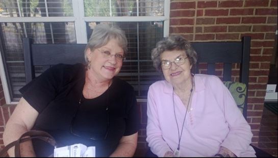 Two women sitting on a bench