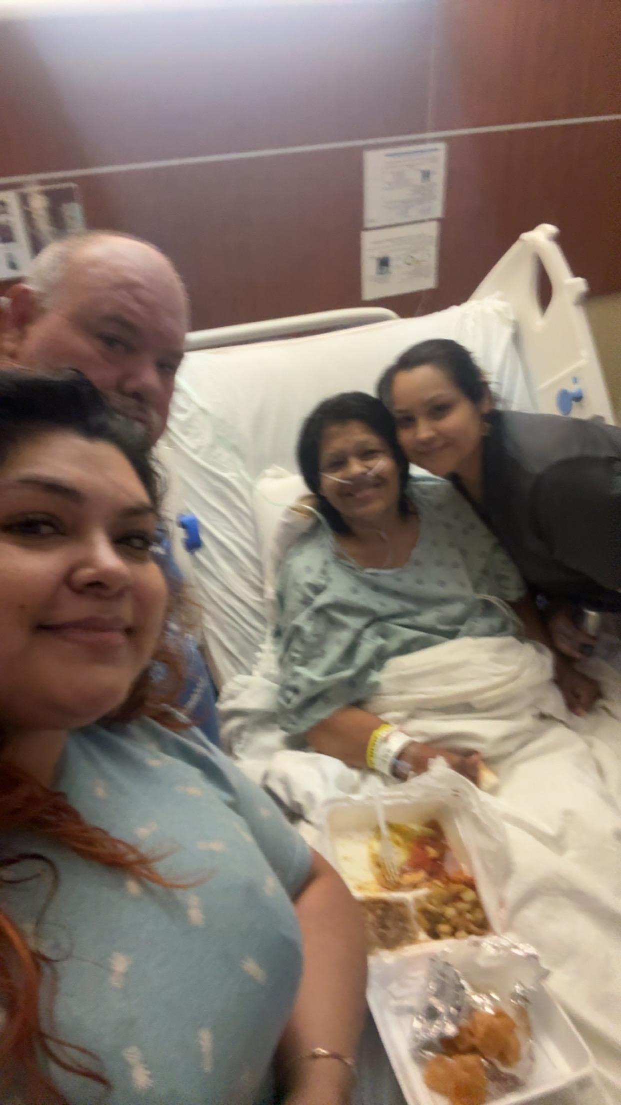 A group of people in a hospital bed
