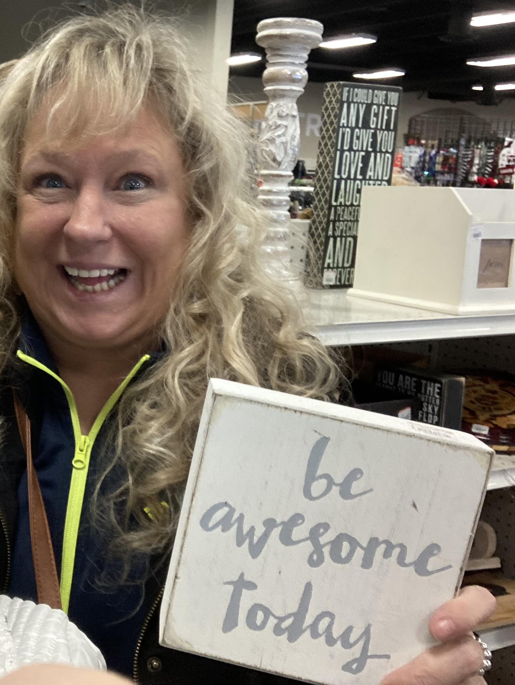 A woman holding a sign
