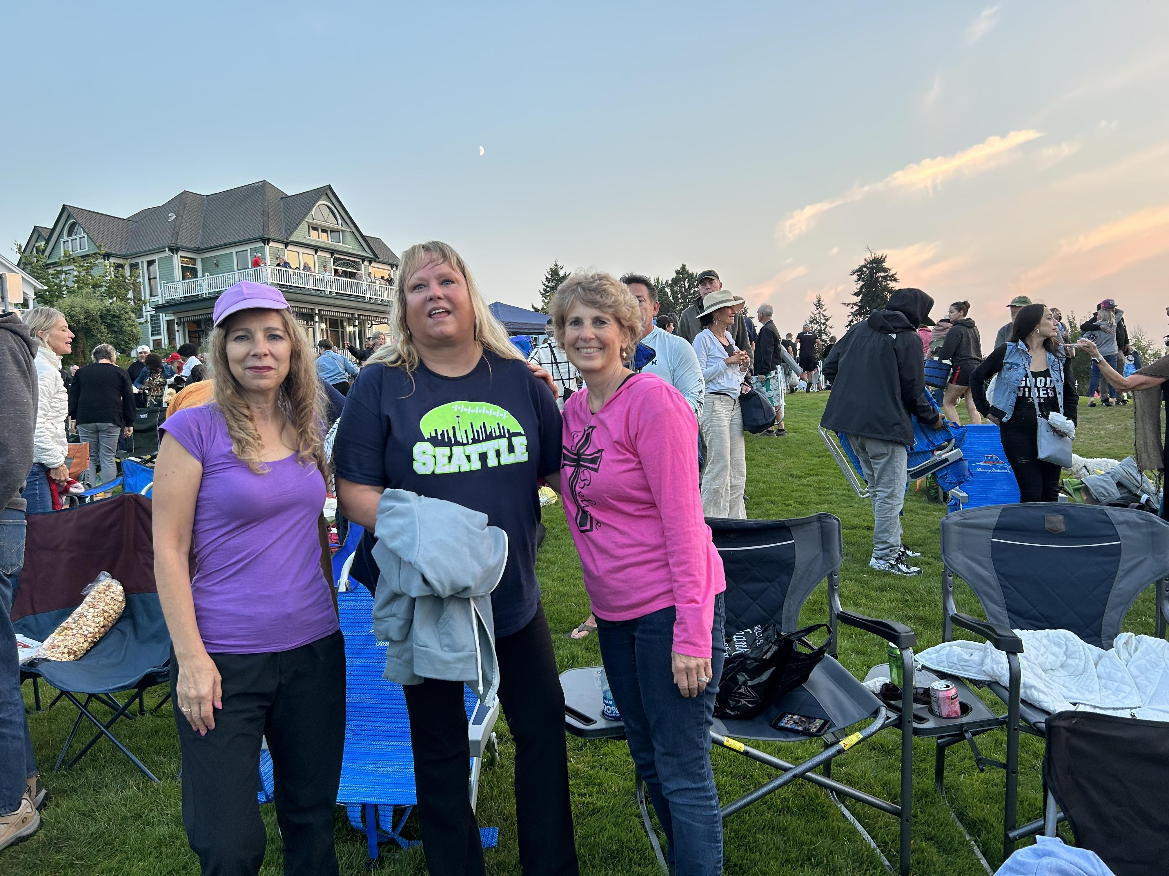 A group of women standing in a field