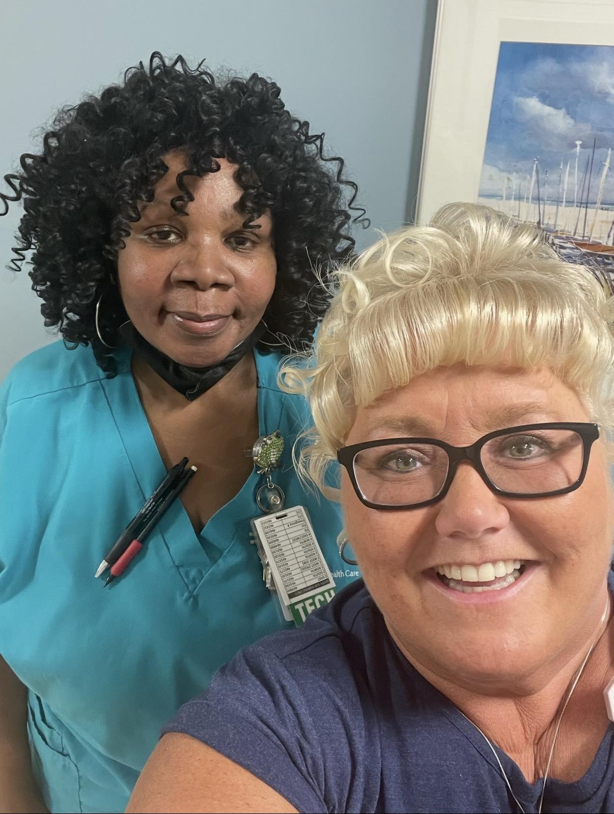 A woman taking a selfie with a nurse
