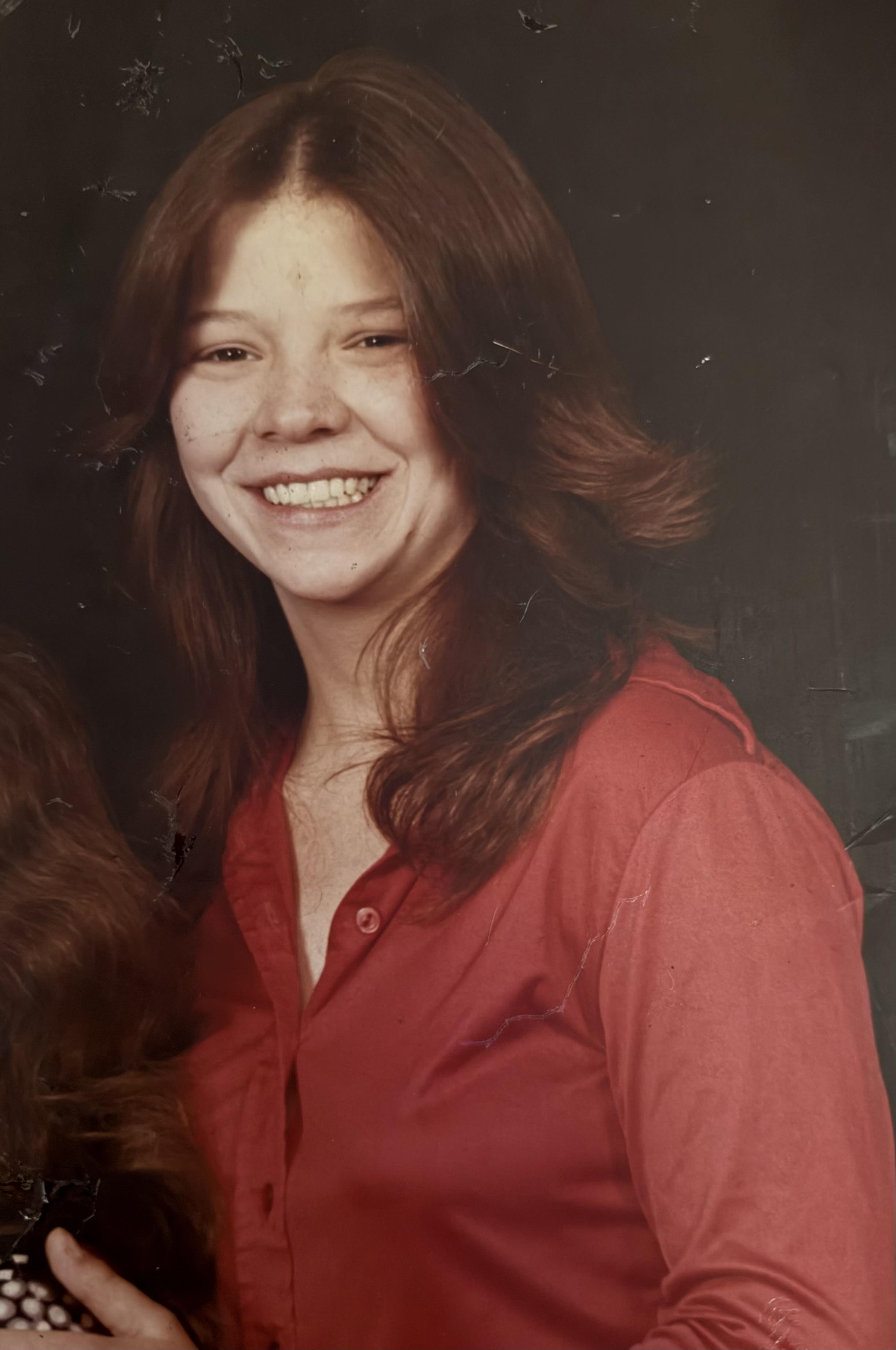 A woman smiling at the camera