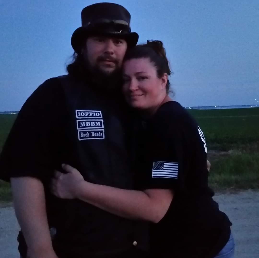 A man and woman posing for a picture