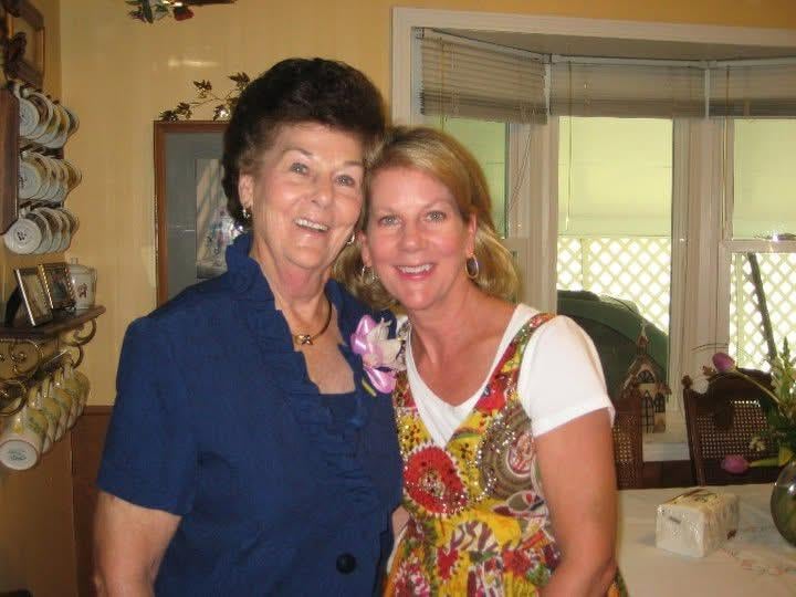 A couple of women posing for a picture