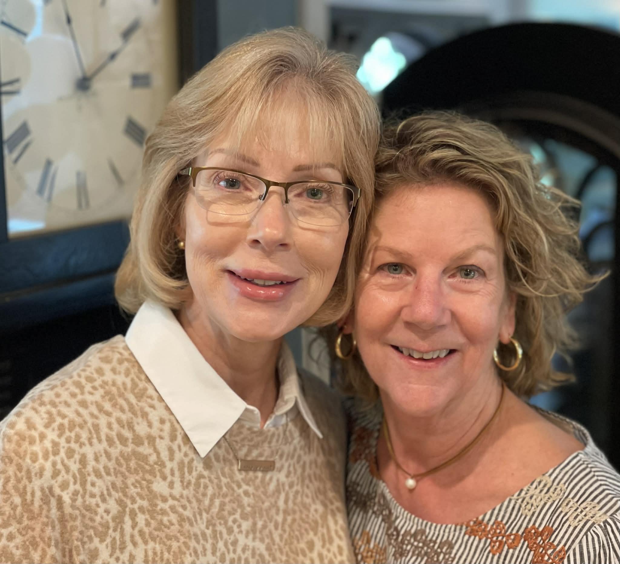 A couple of women smiling for a picture