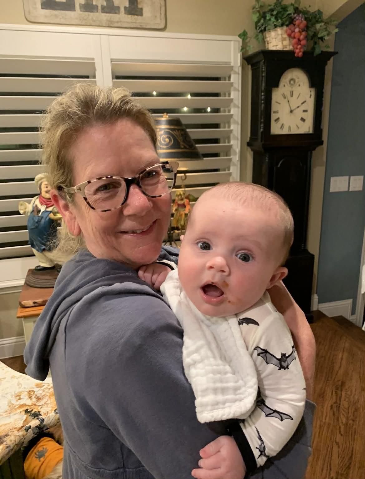 A woman holding a baby