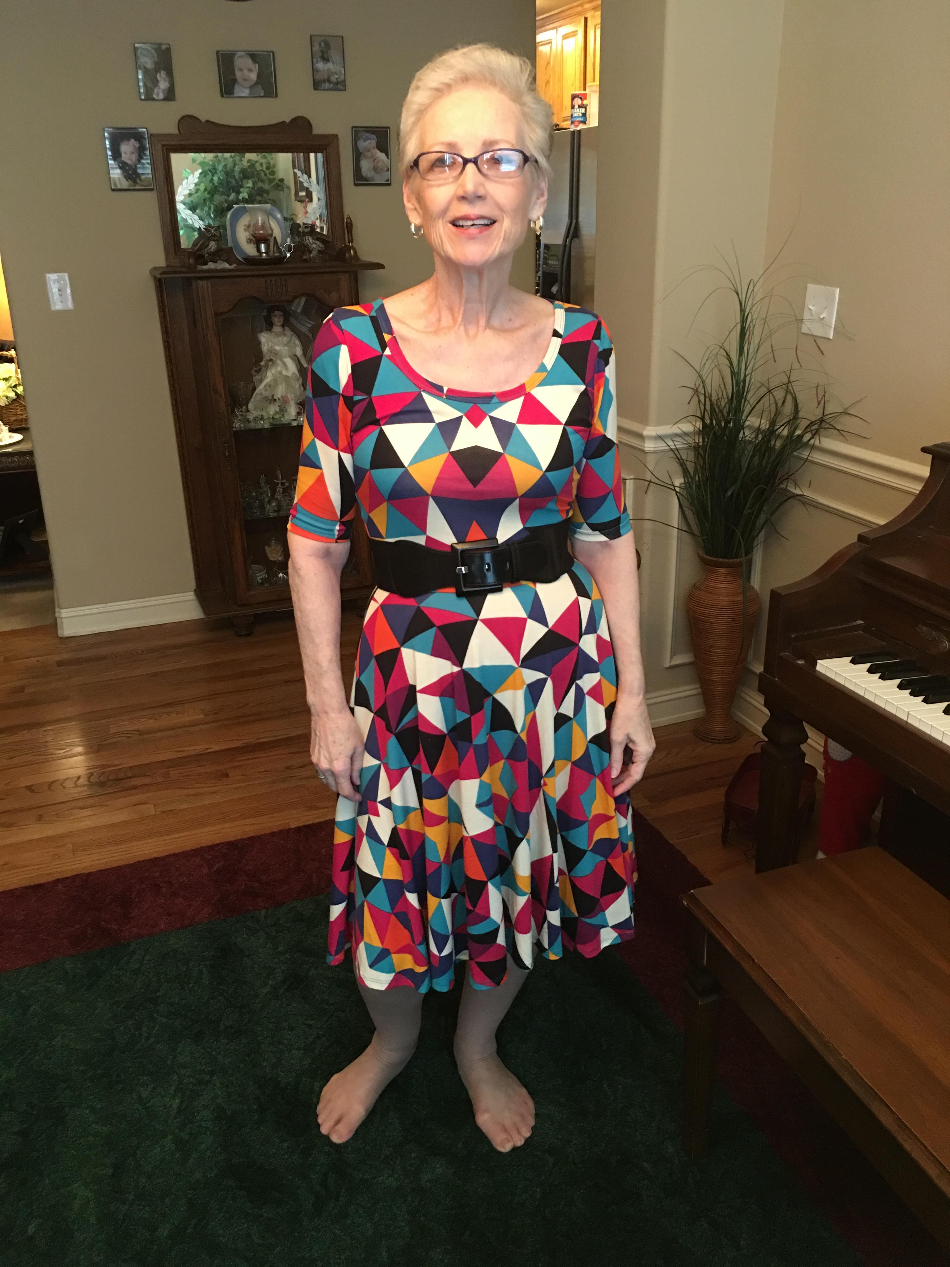 A woman wearing a colorful dress