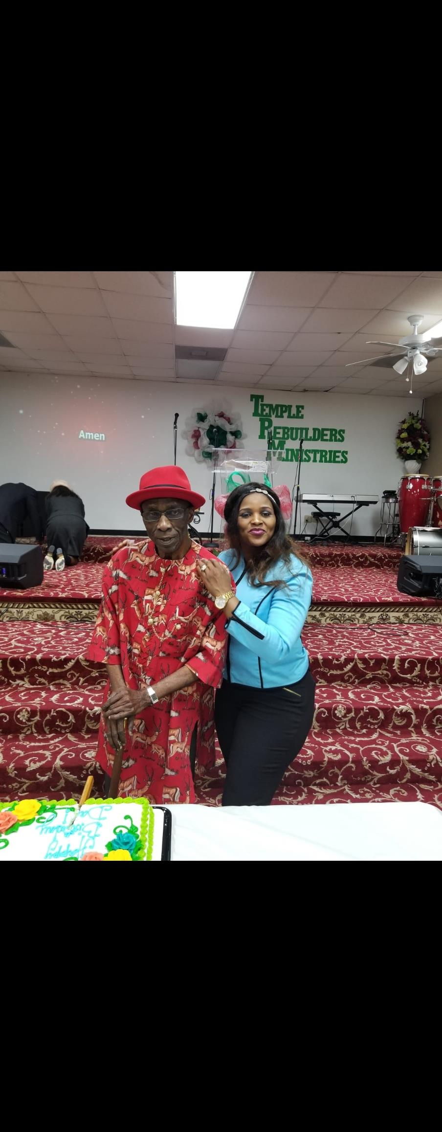 A man and woman posing for a picture