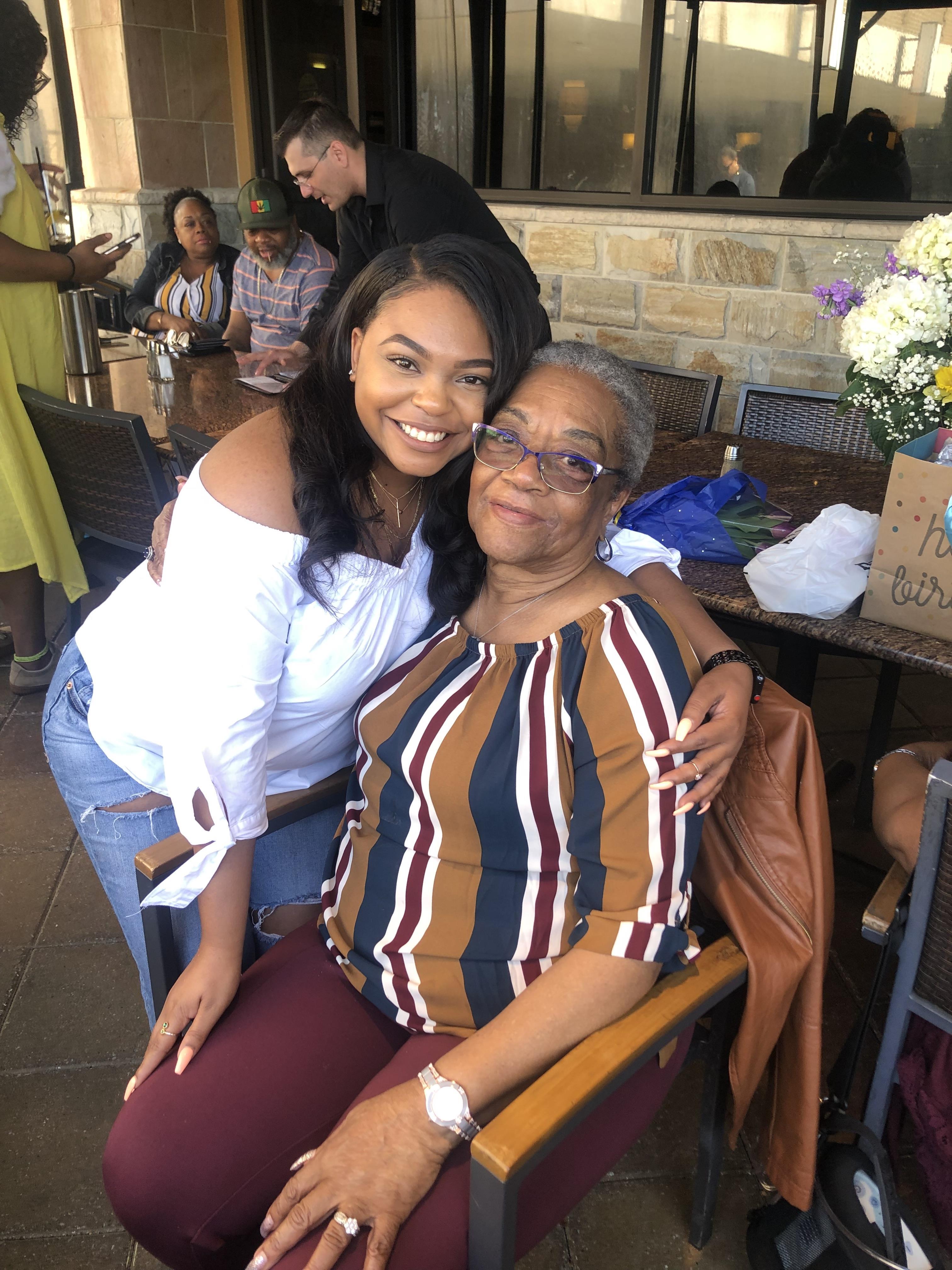 A woman hugging another woman
