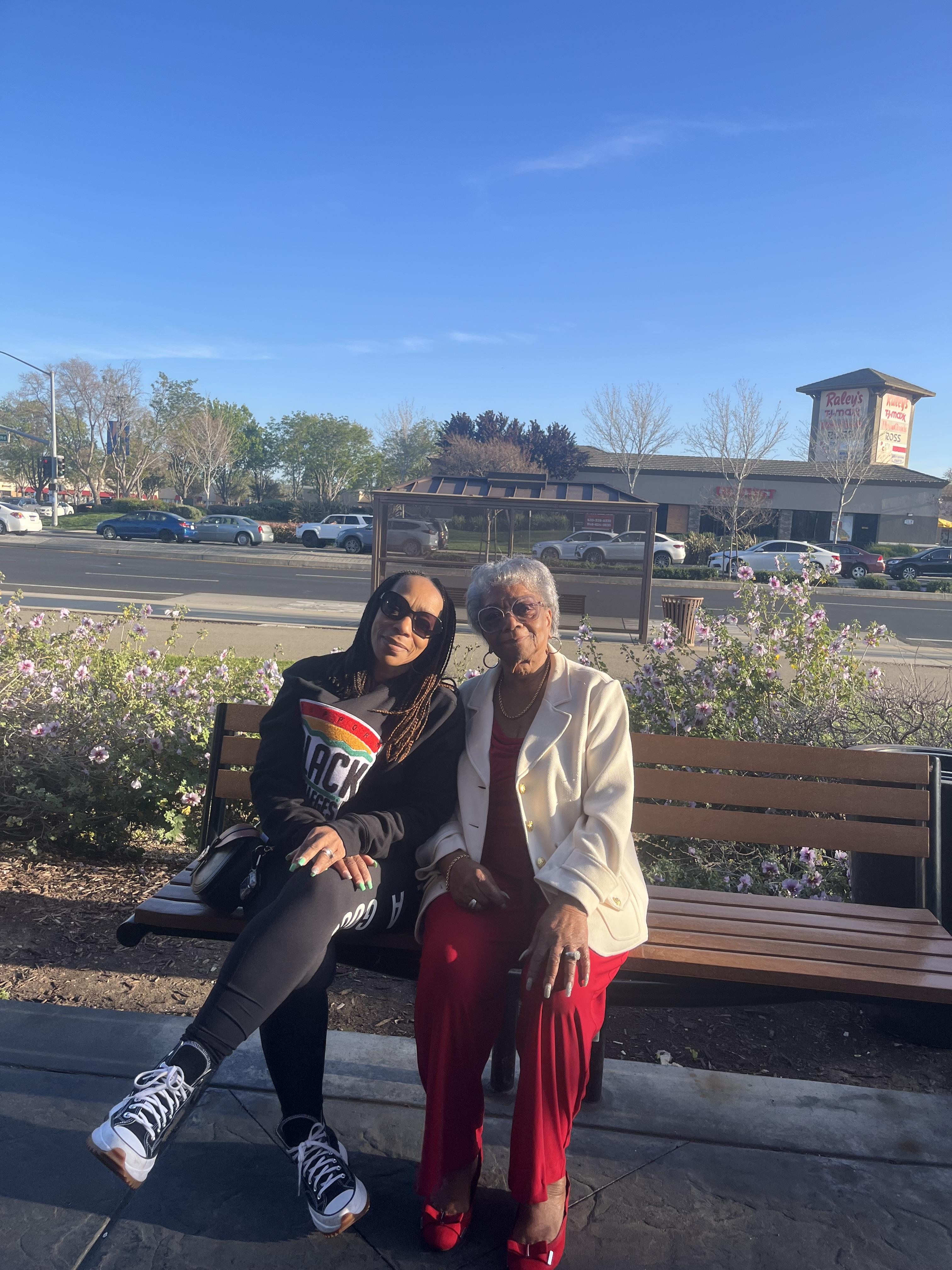 Two women sitting on a bench