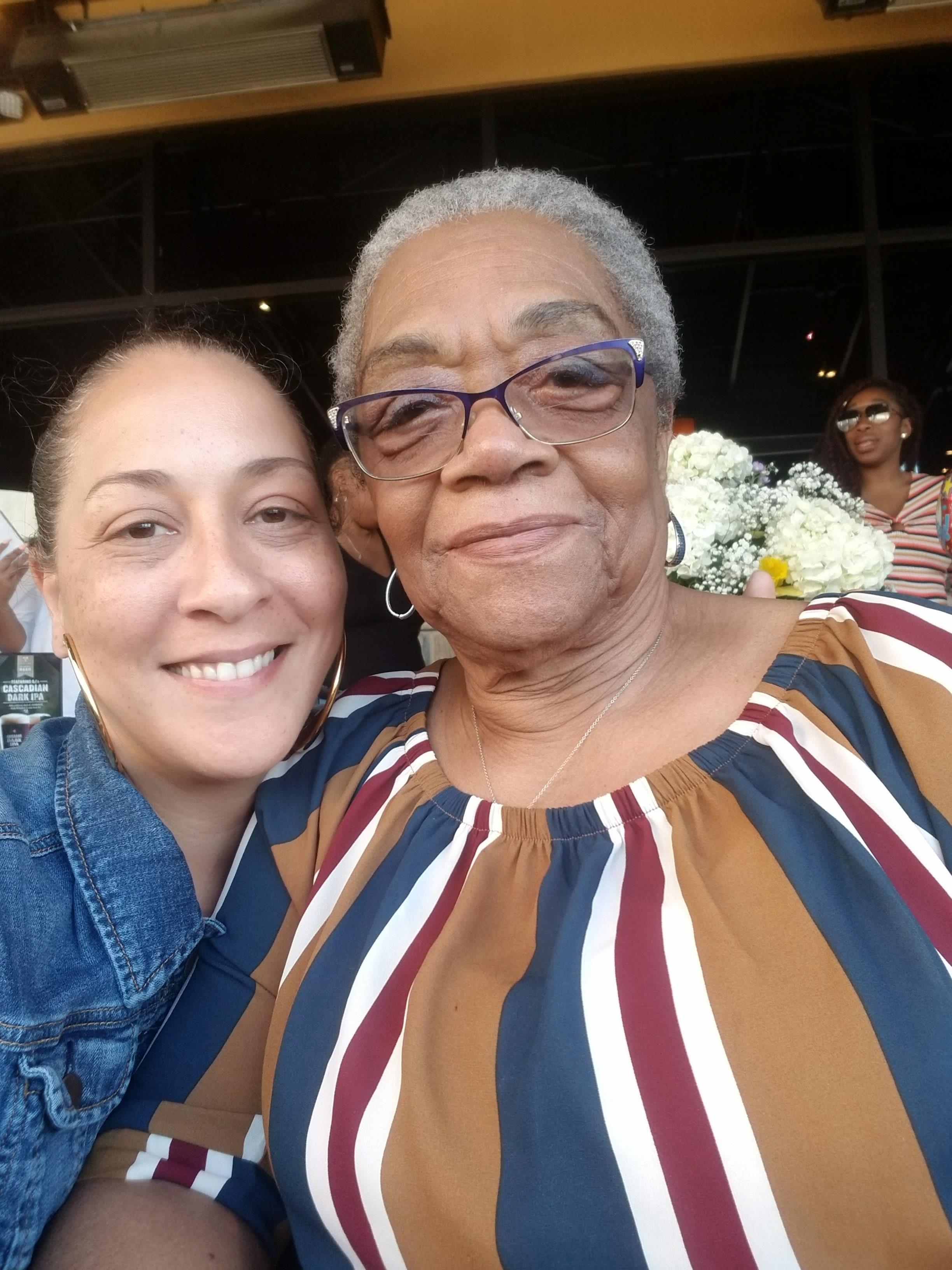 A woman and a woman smiling
