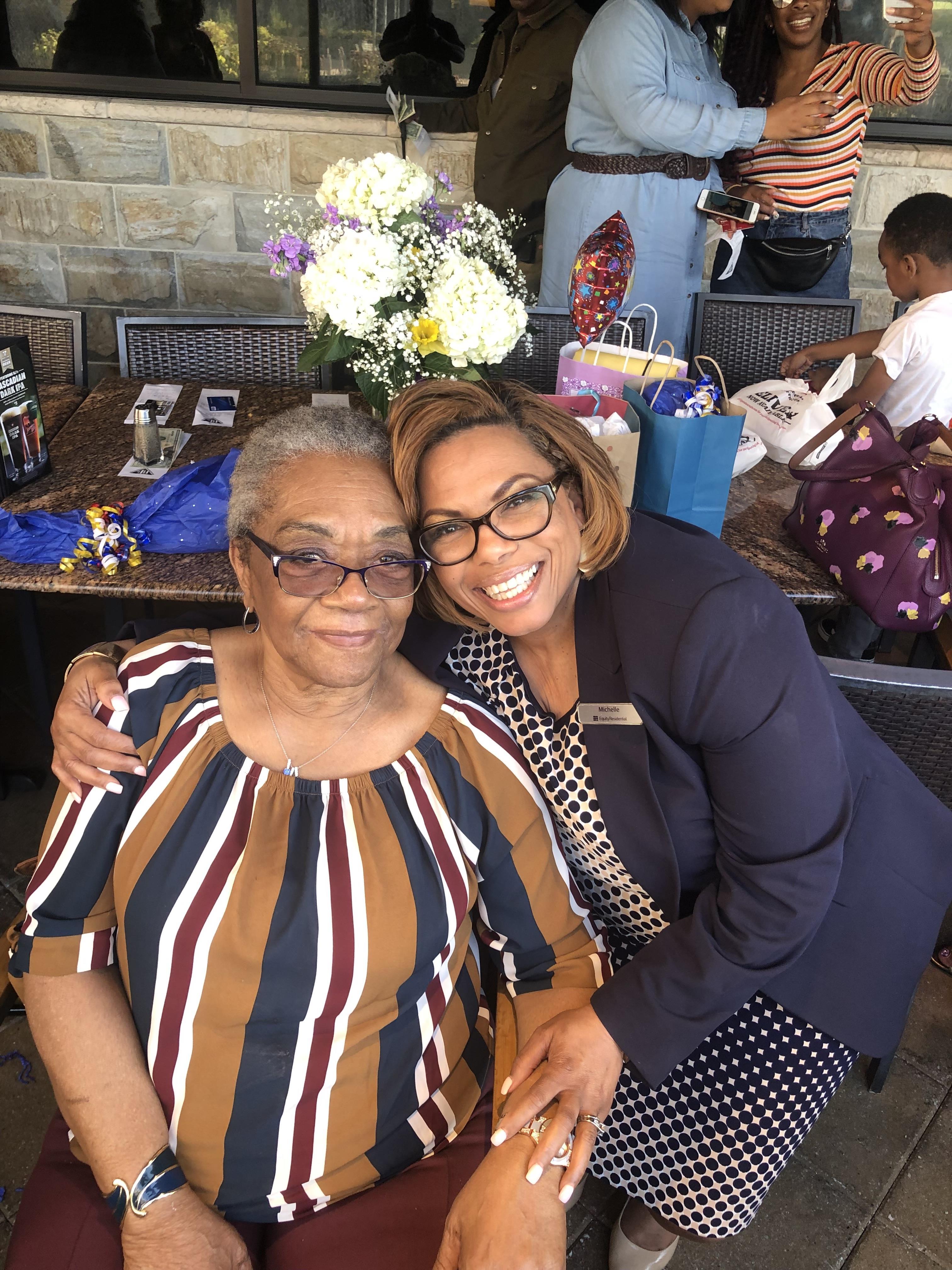 Two women sitting together smiling