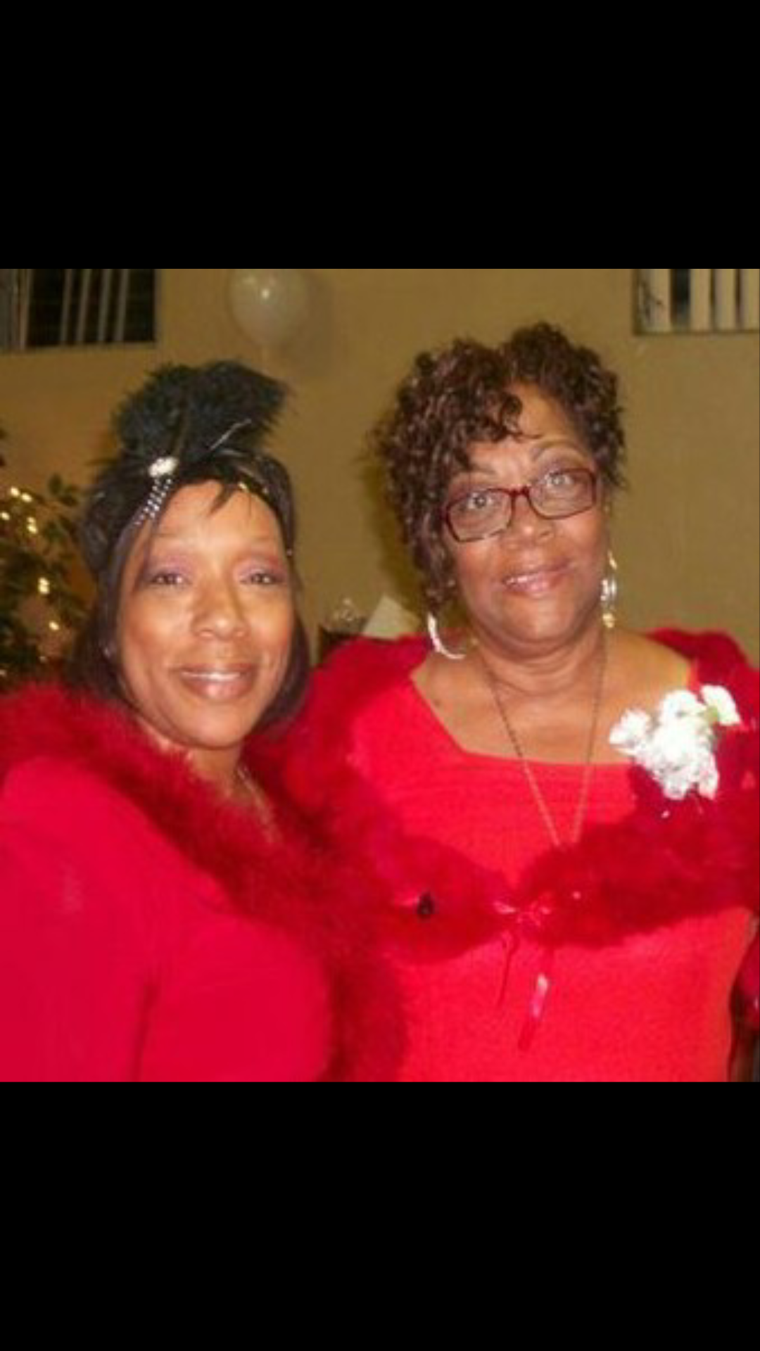 A couple of women in red