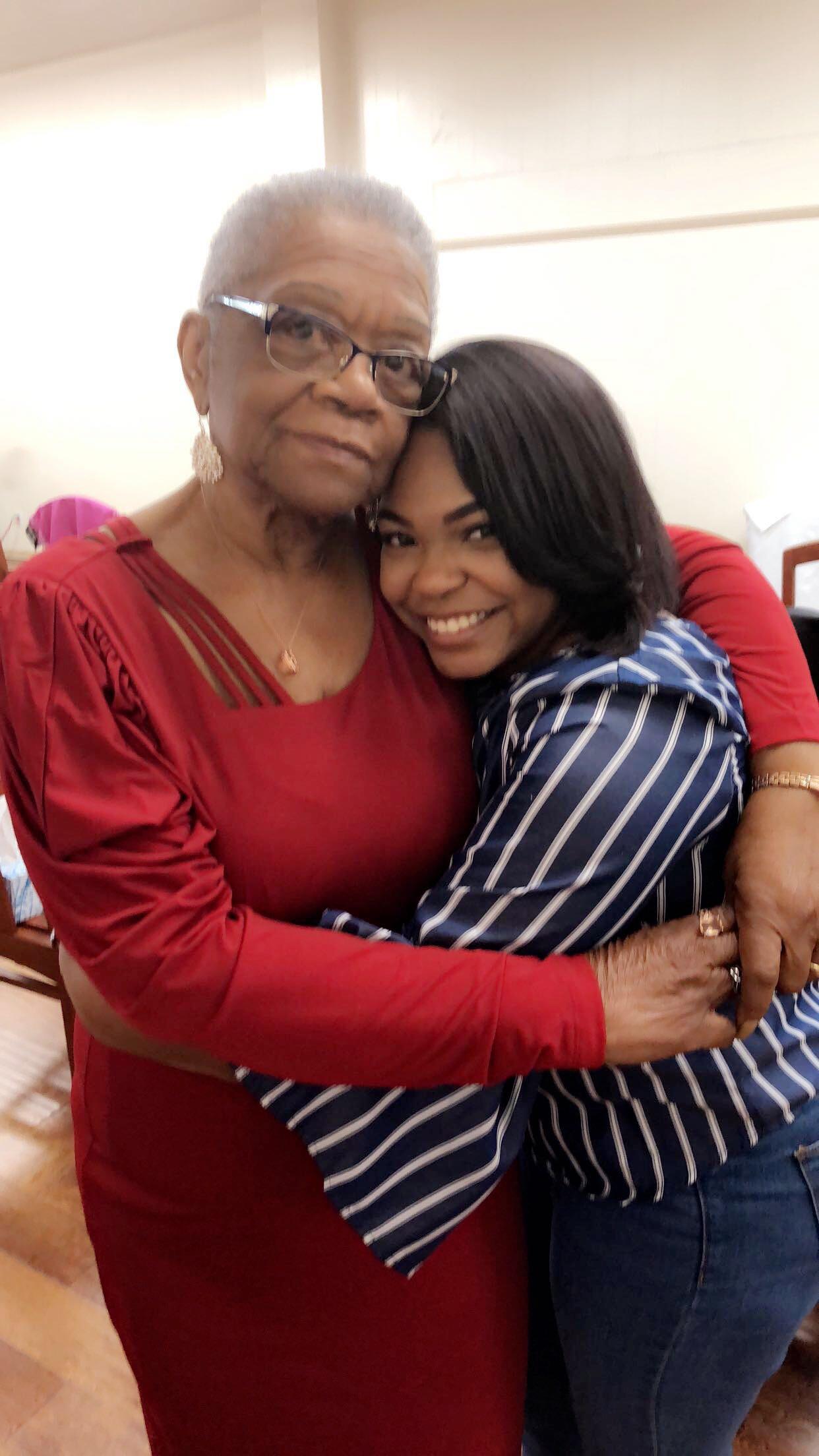 Two women hugging each other