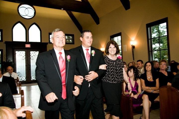 A man and woman walking down the aisle