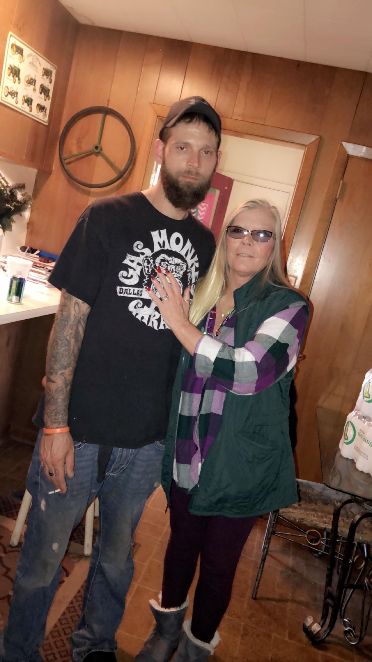 A man and woman posing for a picture