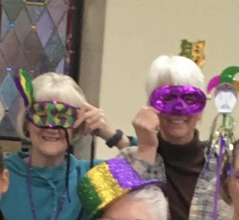 A group of people wearing masks