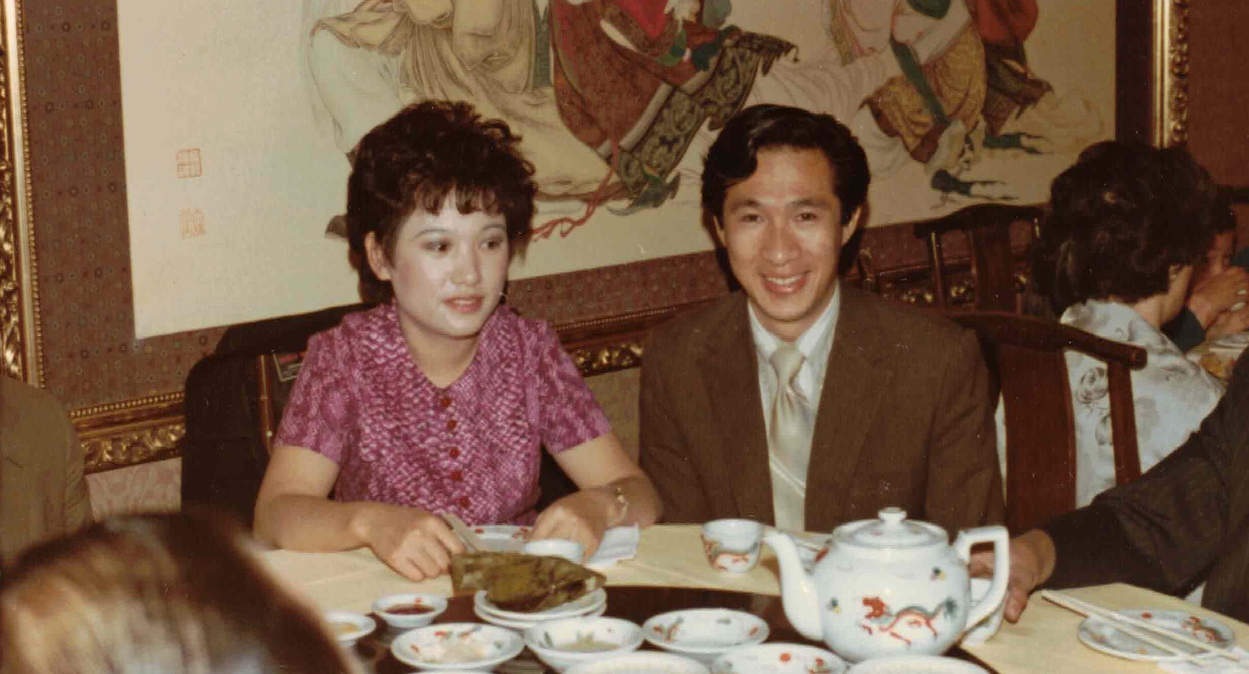 A man and woman sitting at a table