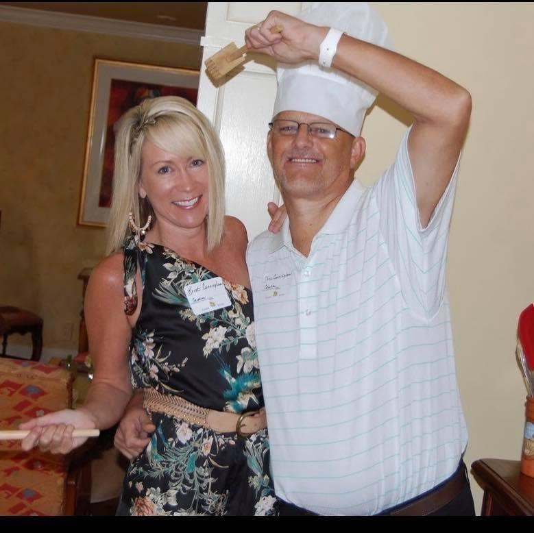 A man and woman holding utensils